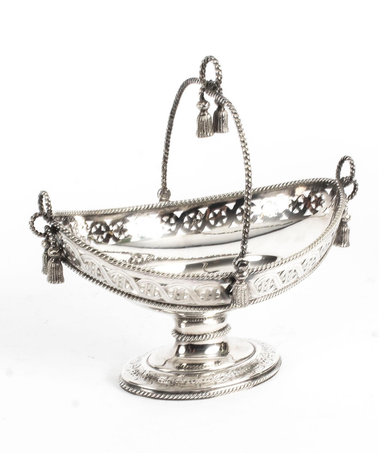 A superb small antique swing-handled oval silver plated sweet basket, 19th century. It bears the Victorian Registration mark for 24th August 1861.

There is no mistaking its unique quality and design, which is sure to make it a treasured piece by