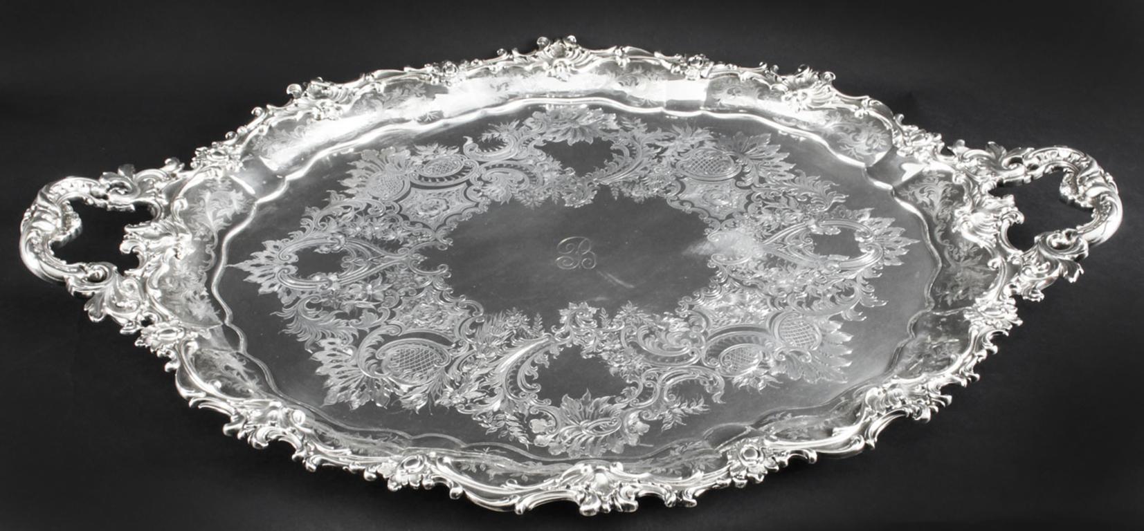This is a magnificent antique English Victorian oval silver-plated twin handled tray by the renowned Silversmith Manoah Rhodes & Sons, Bradford, circa 1880 in date.
 
This splendid tray features beautifully engraved and embossed foliate and floral