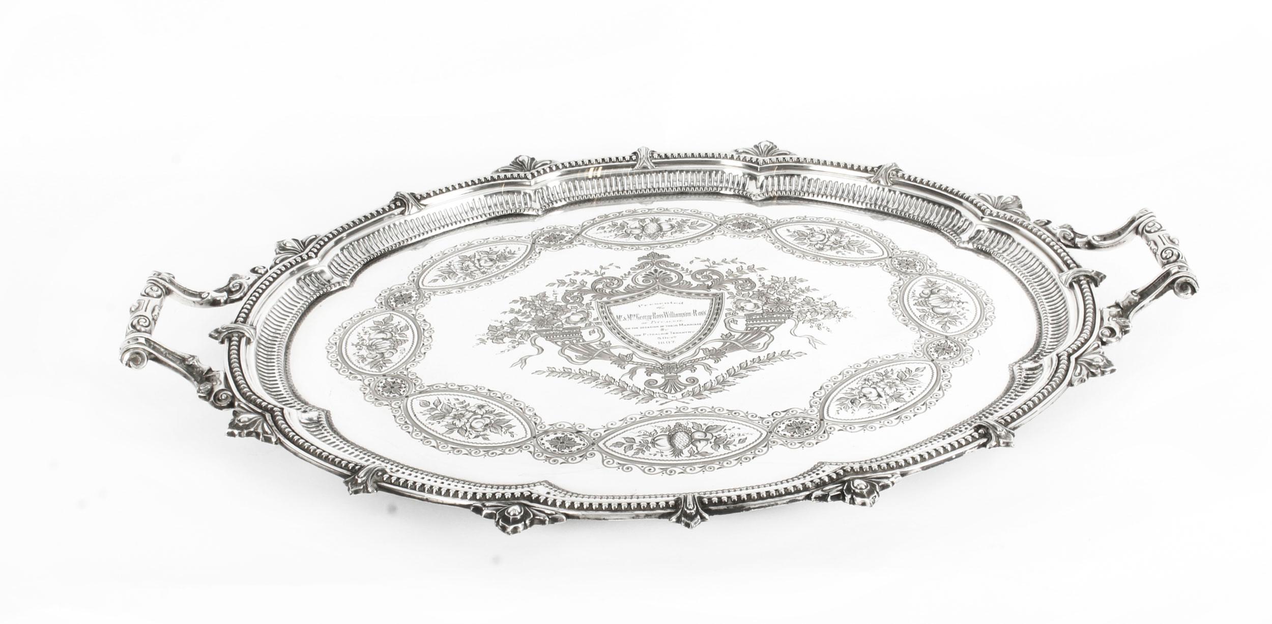This is a magnificent antique English Victorian oval silver plated twin handled tray by the highly sought after silversmiths Mappin & Webb, Sheffield, circa 1880 in date.
 
This splendid tray features beautifully engraved and embossed foliate and