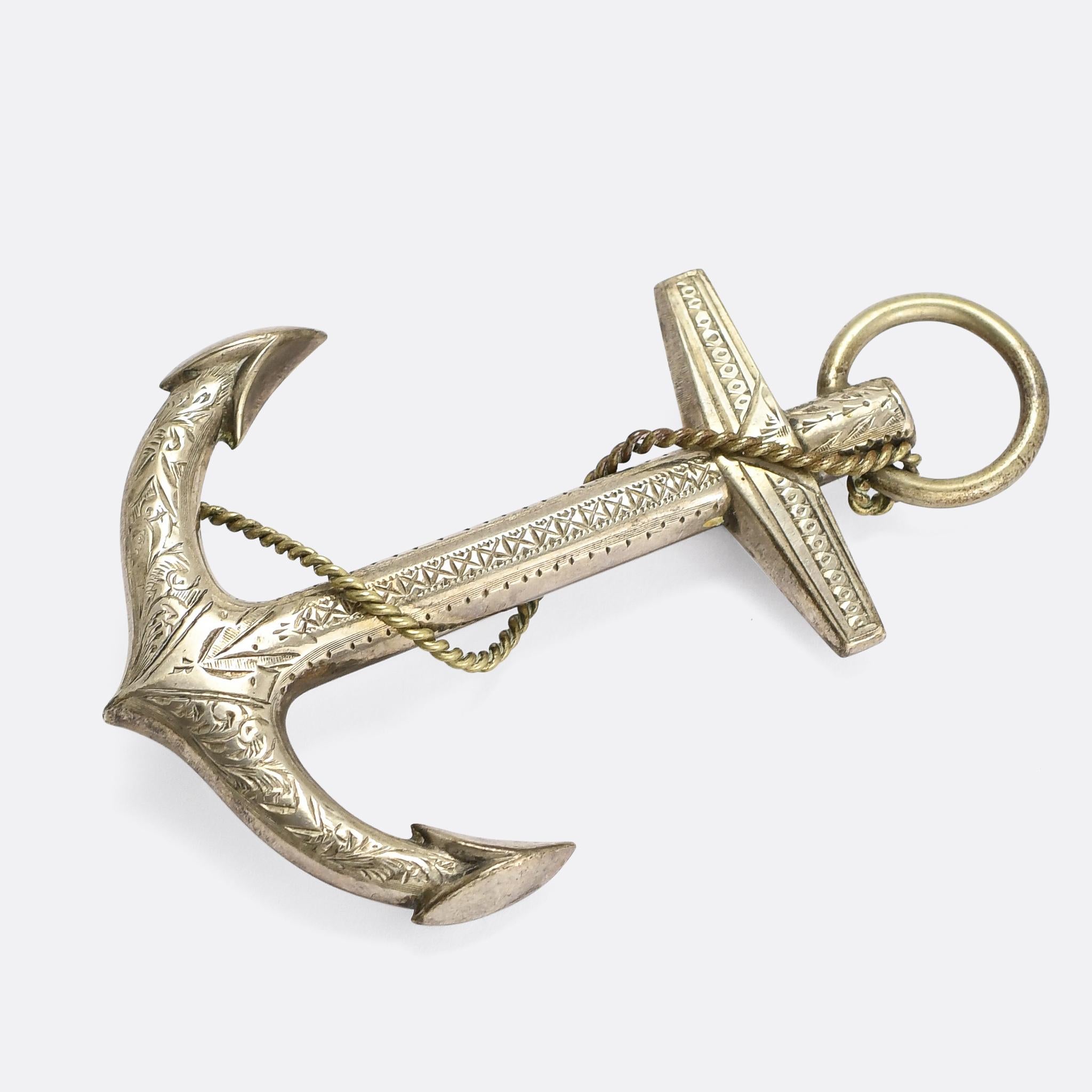 A fantastic oversized silver anchor brooch dating from the mid Victorian period, circa 1860. It's intricately hand-chased with geometric, foliate, and other abstract motifs, and crafted in sterling silver. The rope coiled around it makes it what's