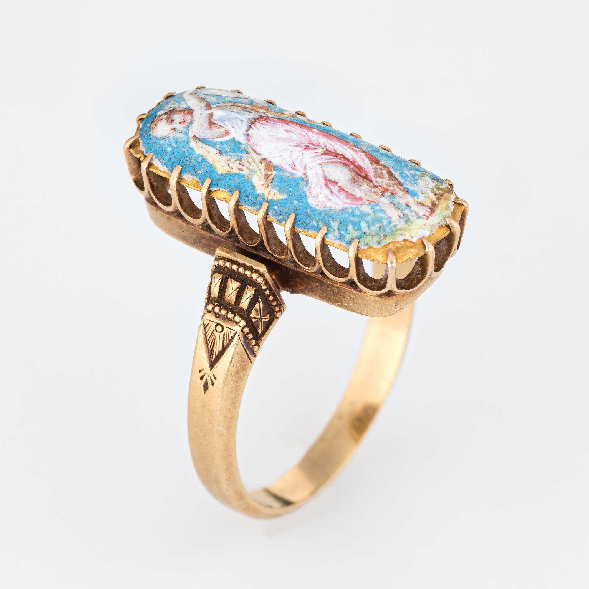Finely detailed antique Victorian painted portrait ring (circa 1880s to 1900s), crafted in 18 karat yellow gold. 

The ring is set with a rectangular plaque hand painted with the image of the Greek Muse of Music, Terpsichore. She is typically