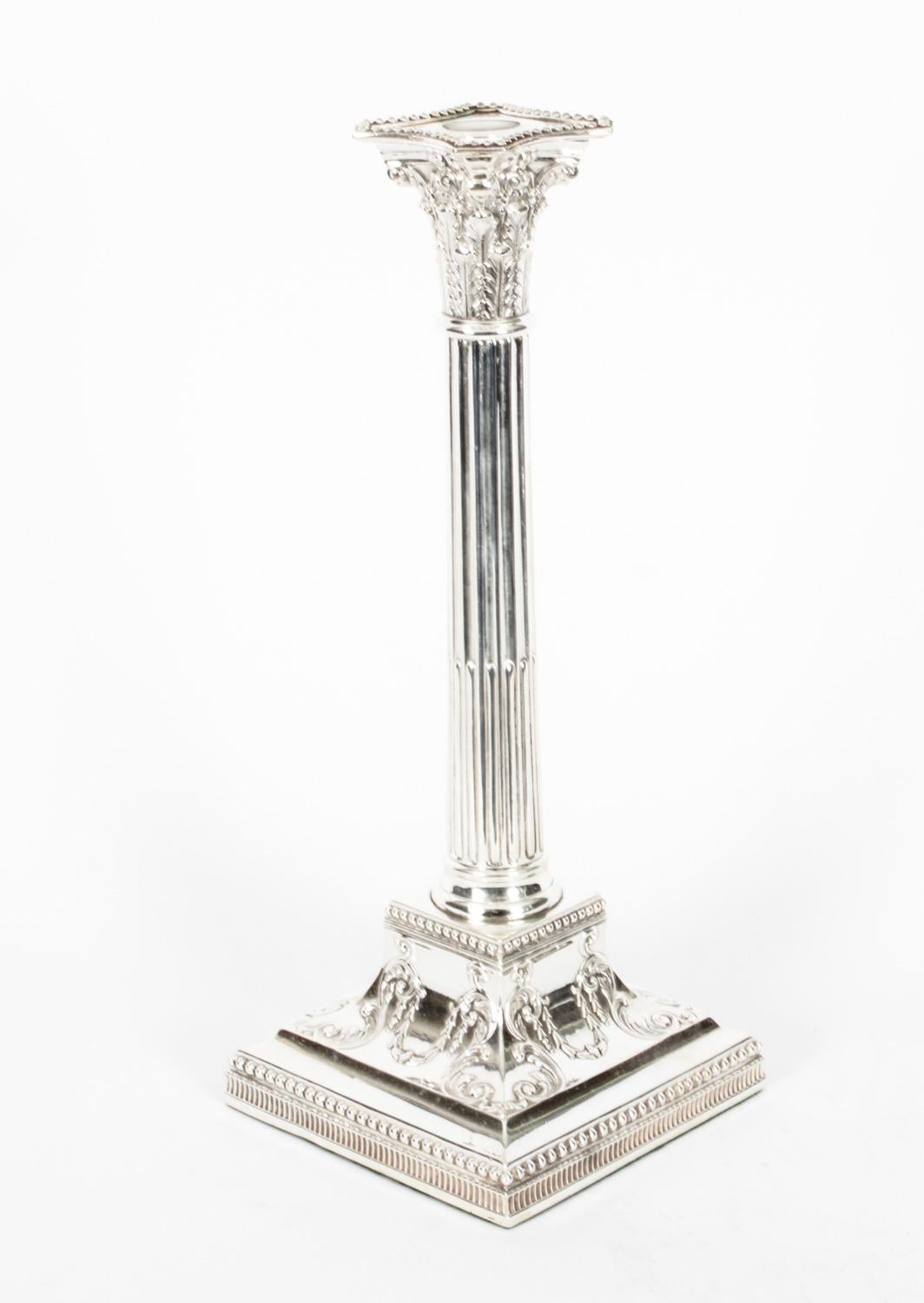 This is an exquisite pair English antique Neoclassical design silver platted candlesticks circa 1880 in date.
 
The candlesticks feature exquisite reeded classical Corinthian columns with trailing garland decoration, and they are raised on solid