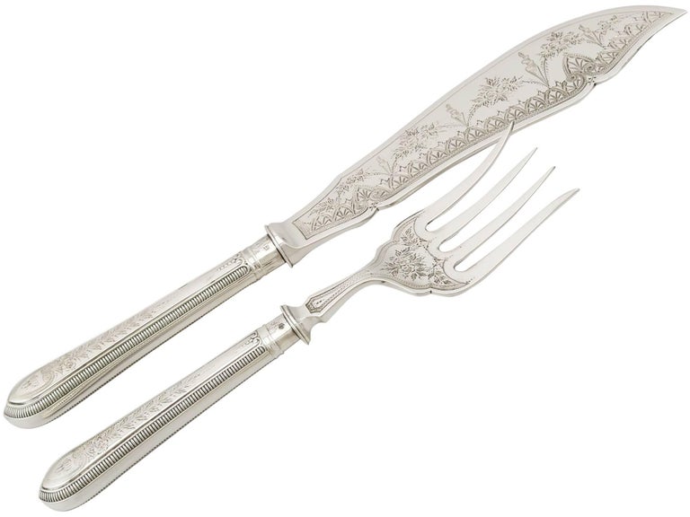 An exceptional, fine and impressive pair of antique Victorian English sterling silver fish servers - boxed; an addition to our silver flatware collection

This exceptional pair of antique Victorian boxed silver fish servers, in sterling standard,