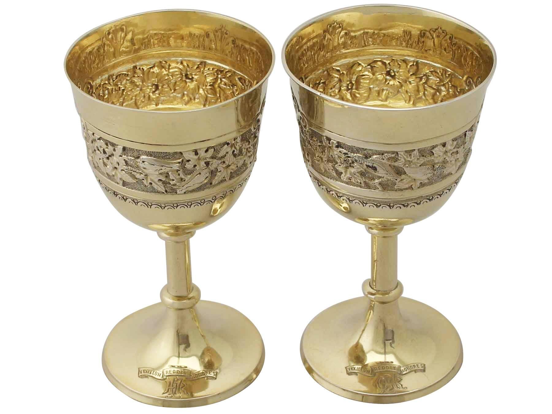 These exceptional antique Victorian sterling silver gilt goblets have a bell shaped form supported by a plain knopped pedestal to a circular spreading foot.

The surface of these Victorian goblets are embellished with chased bands of floral and