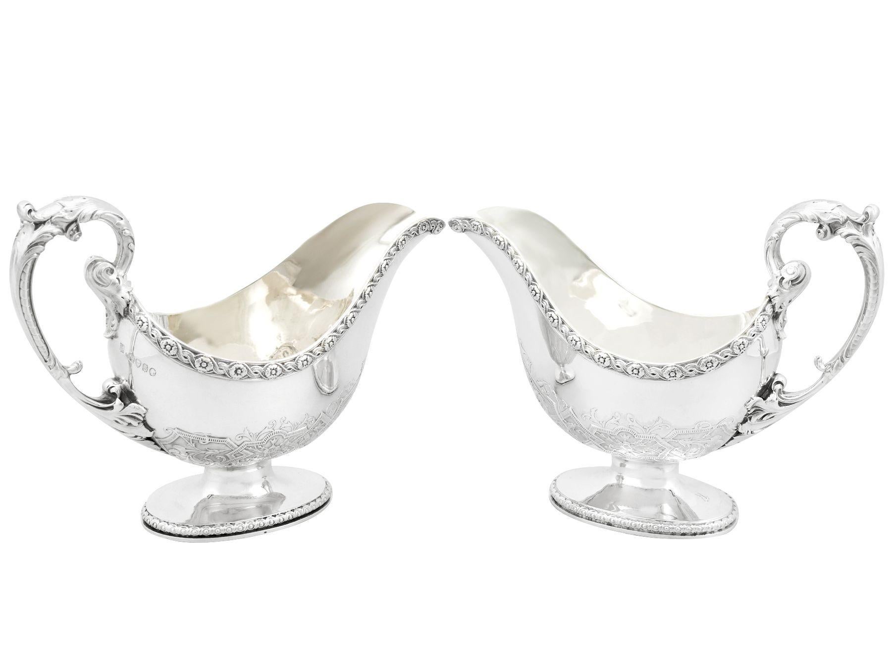 A magnificent, fine and impressive pair of antique Victorian sterling silver sauceboats, an addition to our dining silverware collection.

These magnificent antique Victorian sterling silver sauce boats have a plain oval rounded form onto an oval