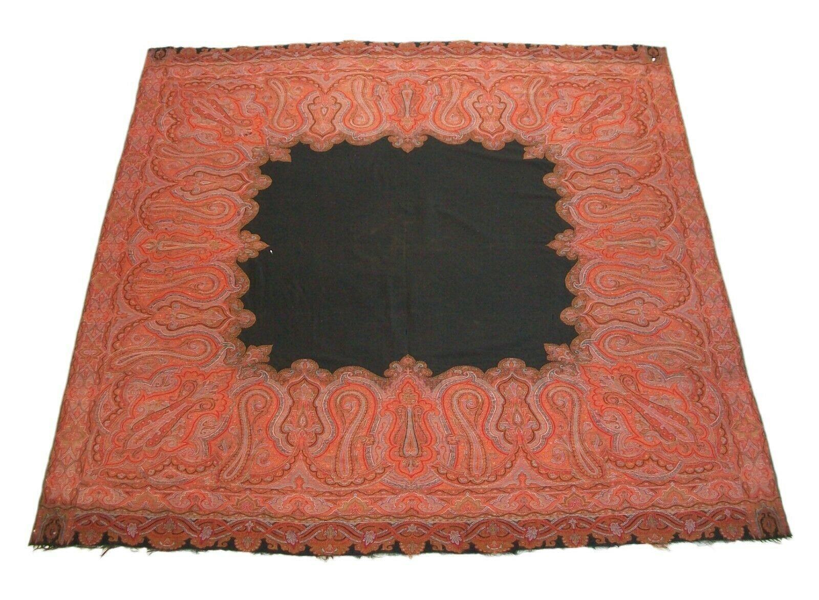 Antique Victorian paisley shawl - fine hand woven pattern with solid black center - fine black fringe to two ends - self woven edges on the other sides - unsigned - circa 1850's.

Good antique condition - a few holes scattered throughout (see