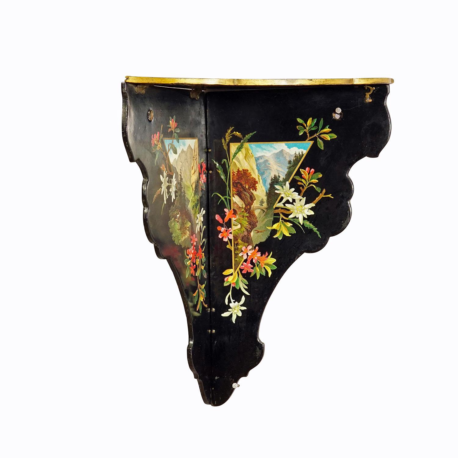 Antique Victorian Papier-Mâché wall shelve with Edelweiss Decoration

A rare antique Papier-Mâché corner shelve with hand painted alpine landscape and edelweiss decoration. Manufactured in Germany, Black Forest in the 19th century. The foldable