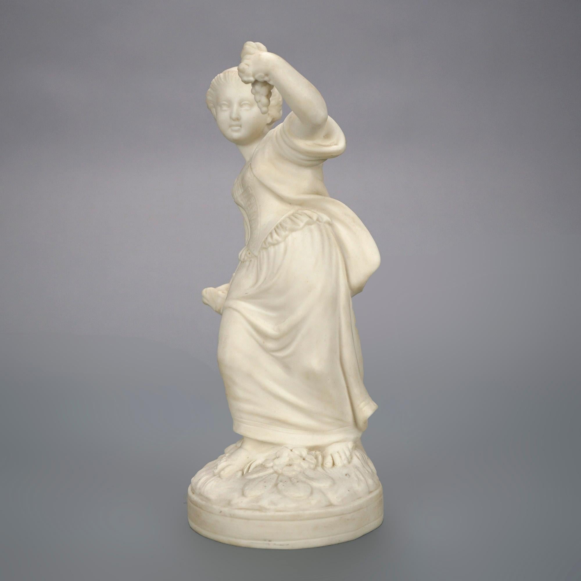 An antique parian statue offers porcelain Classical woman with grapes in countryside setting, 19th century.

Measures- 9''H x 3.75''W x 4''D