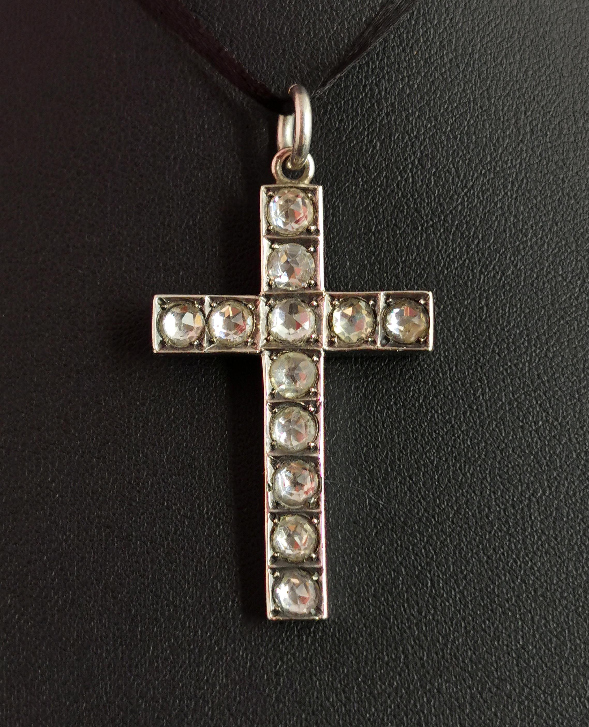 A gorgeous antique, Victorian era paste Cross pendant.

A sterling silver cross adorned with rose cut 'diamond' paste set into a closed back setting.

The cross has a jump ring bale added making it perfect for adding to a neck mess or for a nice