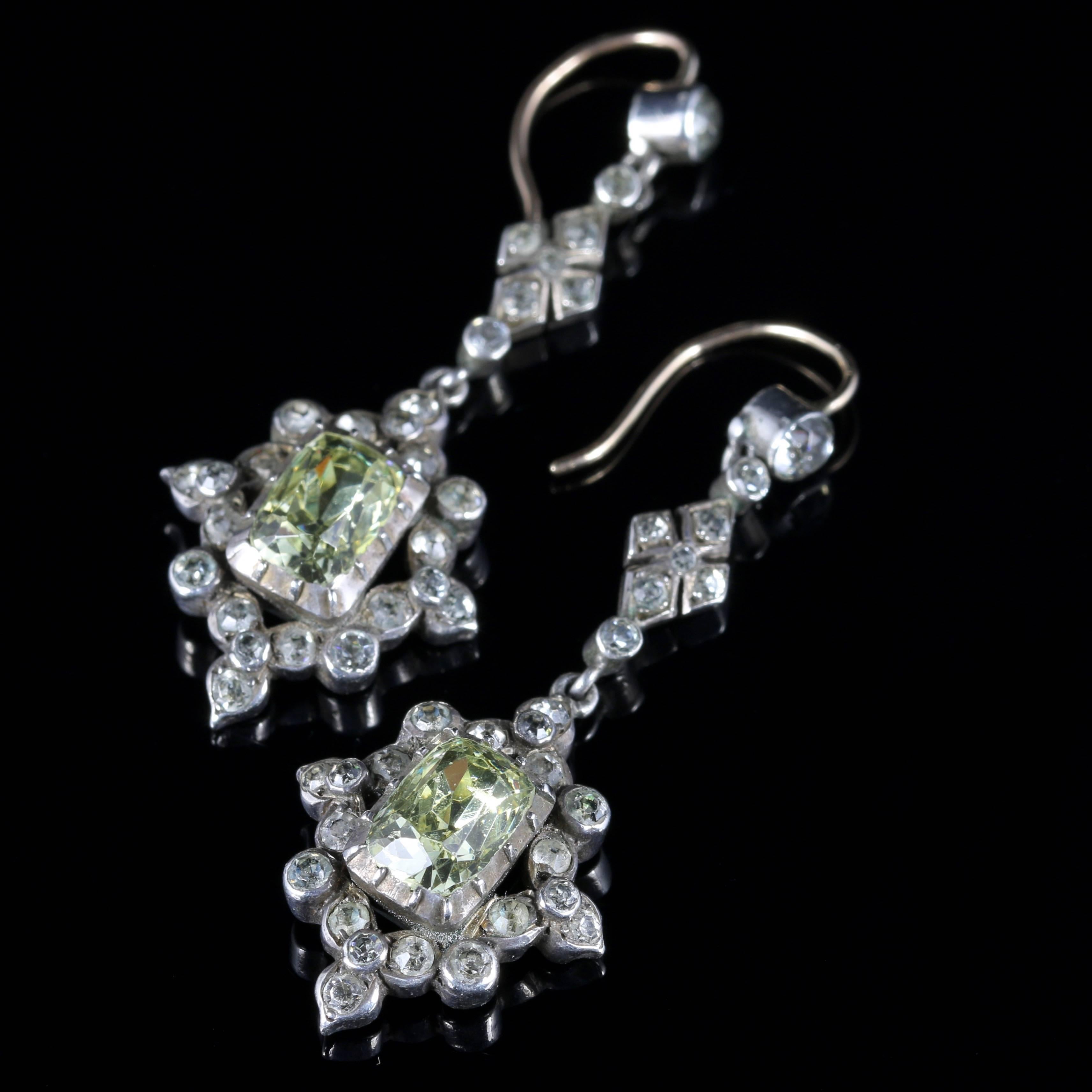 For more details please click continue reading down below...

These fabulous antique Victorian Silver and Gold long earrings are Circa 1860.

Each earring is decorated in sparkling white Paste Stones and adorned with a large Champagne Paste