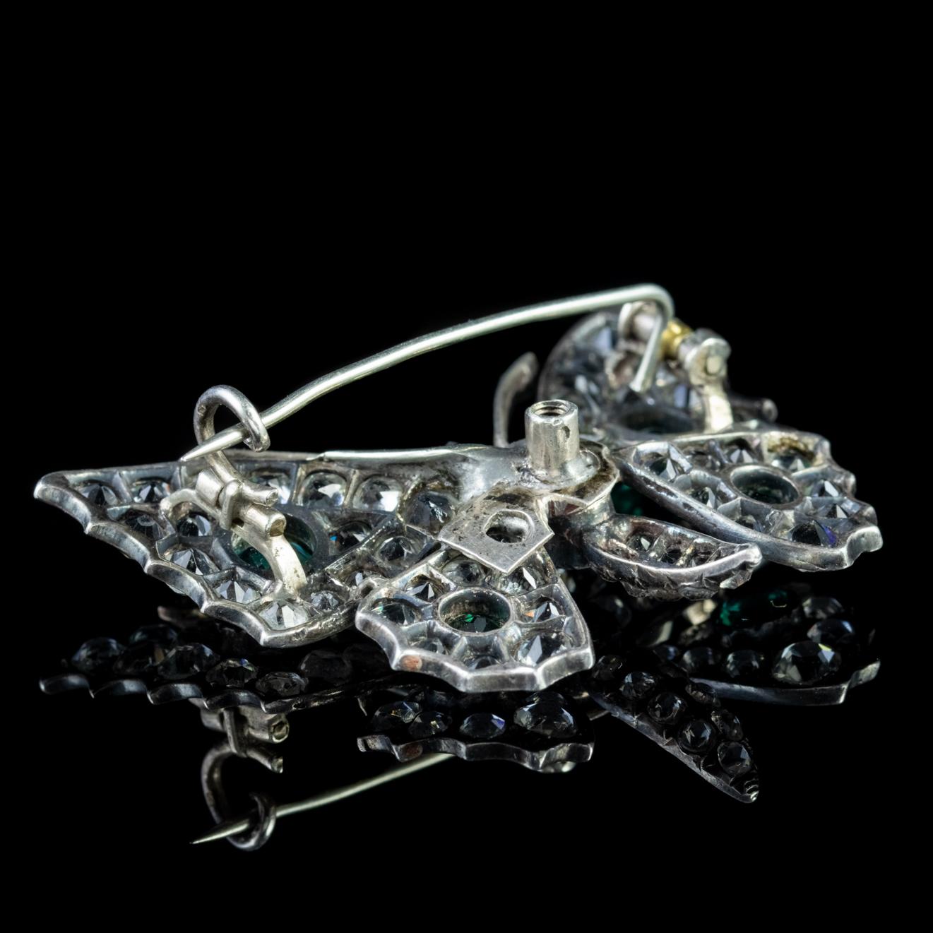 This beautiful Victorian butterfly brooch has been sculpted in silver. It contains sixty two clear, four green and two pink paste stones, the last of which are set as the butterfly’s eyes.

Paste is a heavy, transparent flint glass that simulates