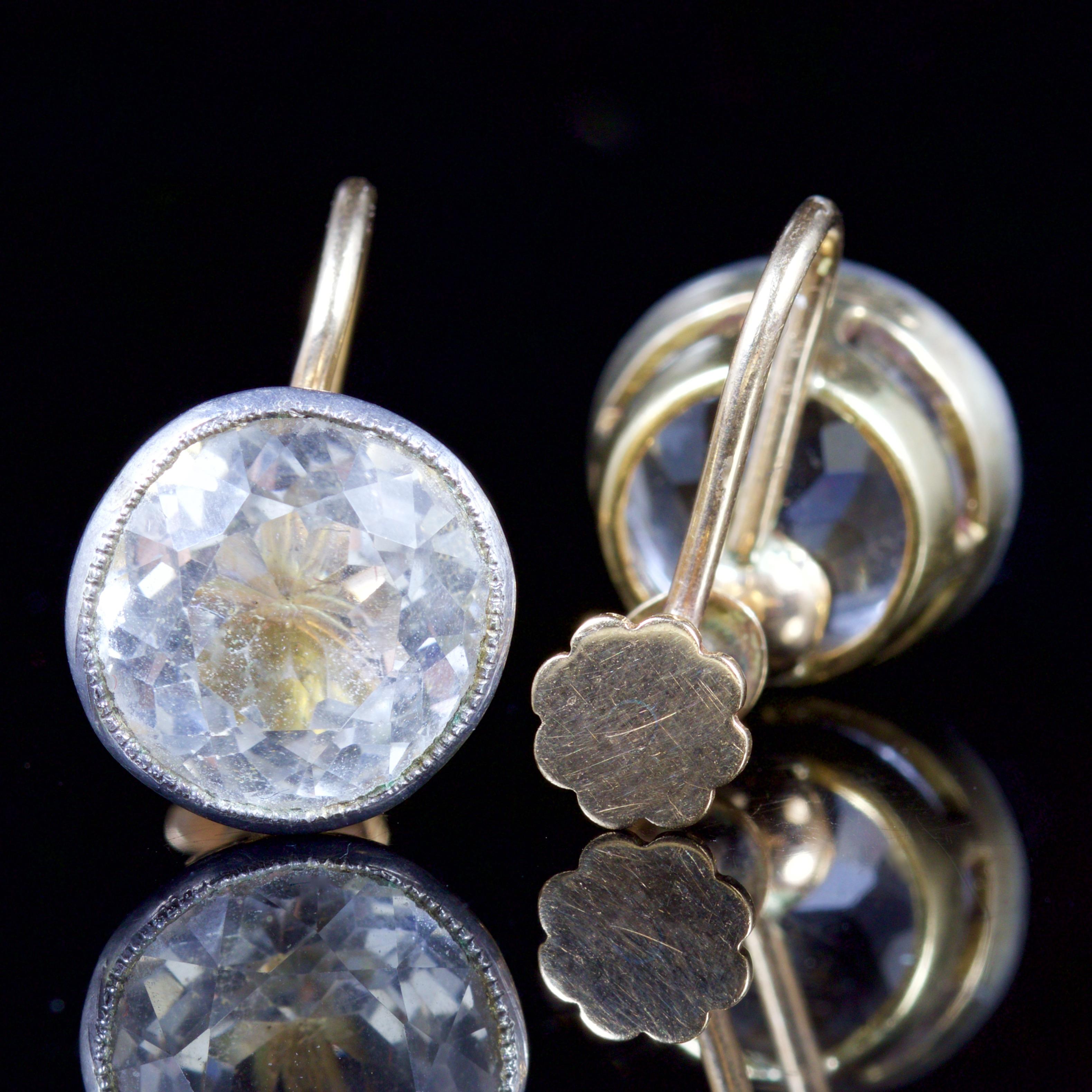 These fabulous Victorian Paste earrings are, Circa 1860.

The earrings are set with a 4ct old cut Paste Stone in a Silver gallery.

The earrings are 18ct Yellow Gold with a screw fitting back.

Paste is a heavy, very transparent flint glass that