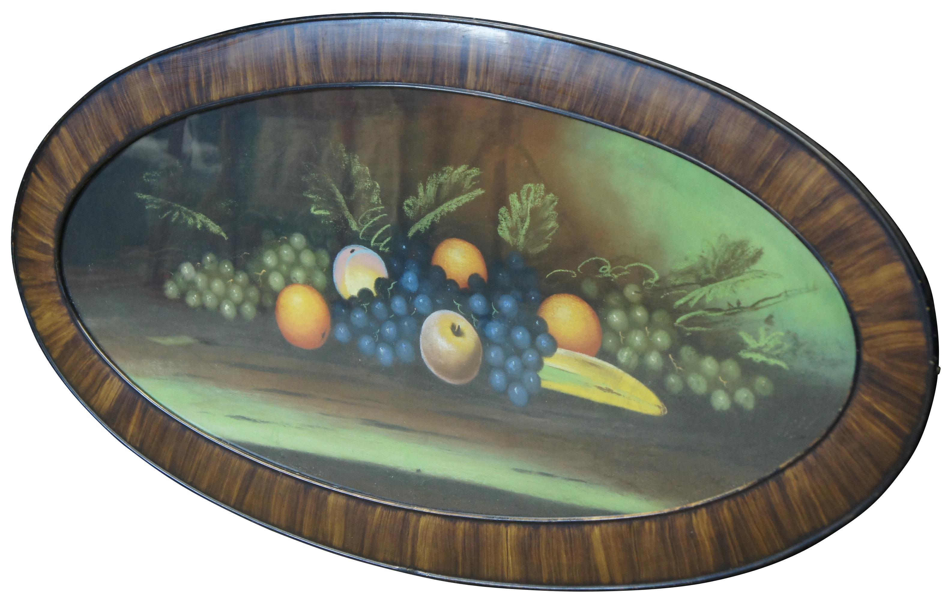 Large antique Victorian pastel painting showing a still life of a variety of fruit, in a faux wood grain oval frame.

Measures: 45.2” x 0.75” x 23.25” / Sans frame - 39.5” x 17.25” (width x depth x height).
   