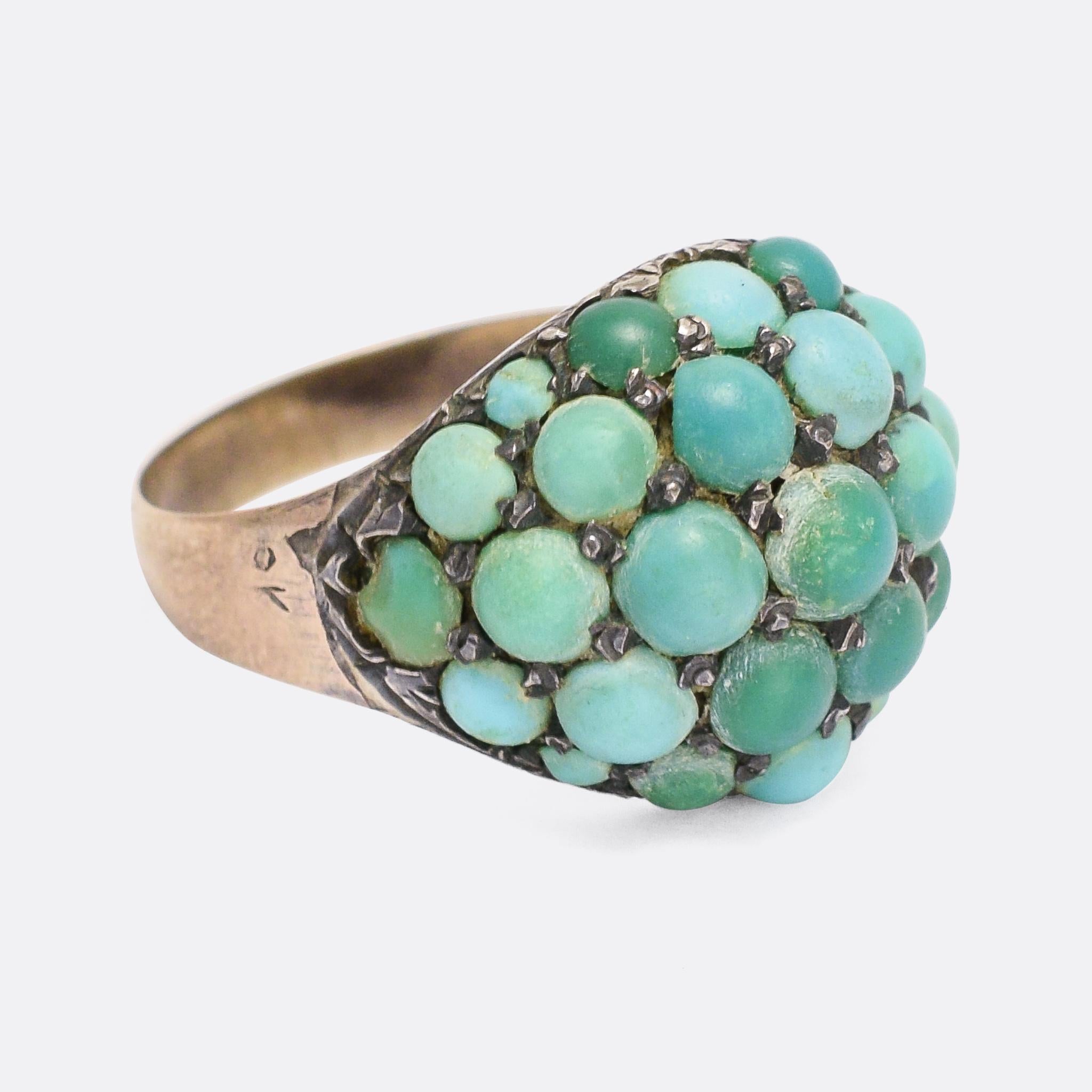 A fine Victorian bombé ring pavé set with turquoise cabochons. The band is modelled in 9k rose gold, while the stones are set in silver making a lovely two-tone metal contrast. Over the years the turquoise have aged beautifully, giving a pleasing