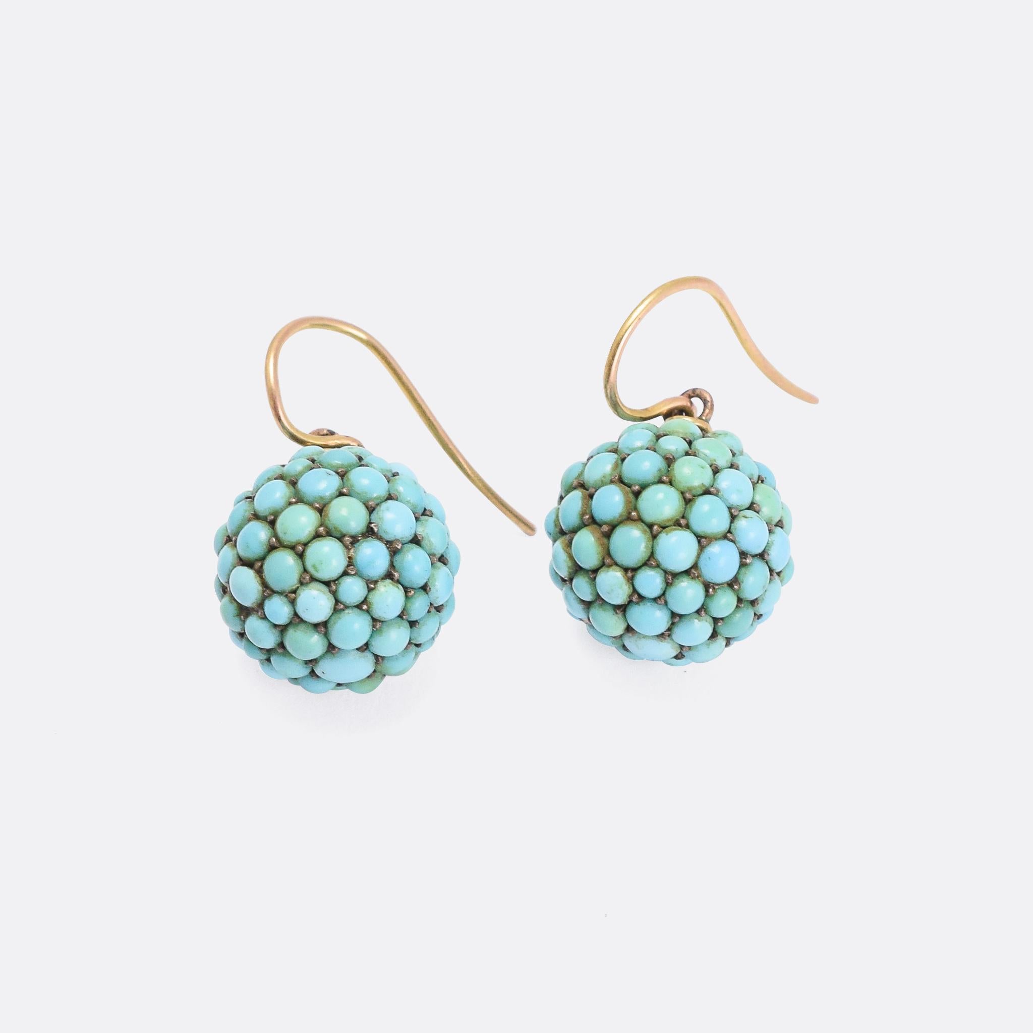 Wonderful antique orb earrings fully pavé set with turquoise cabochons. The date from the mid Victorian period, circa 1870, and remain in fantastic condition. They're a good size at 1.5cm in diameter, and are light enough for comfortable wear.

The