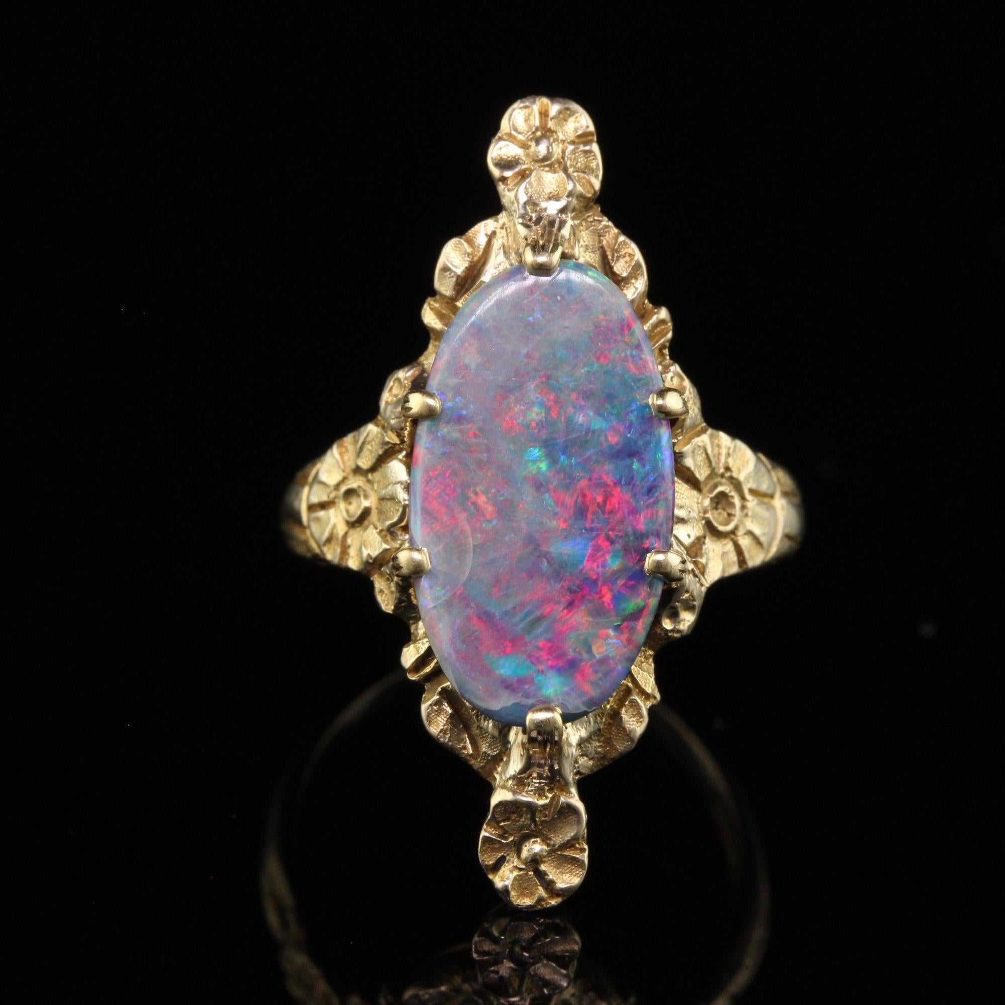 Antique Victorian Peacock 10K Yellow Gold Boulder Opal Floral Ring In Good Condition For Sale In Great Neck, NY