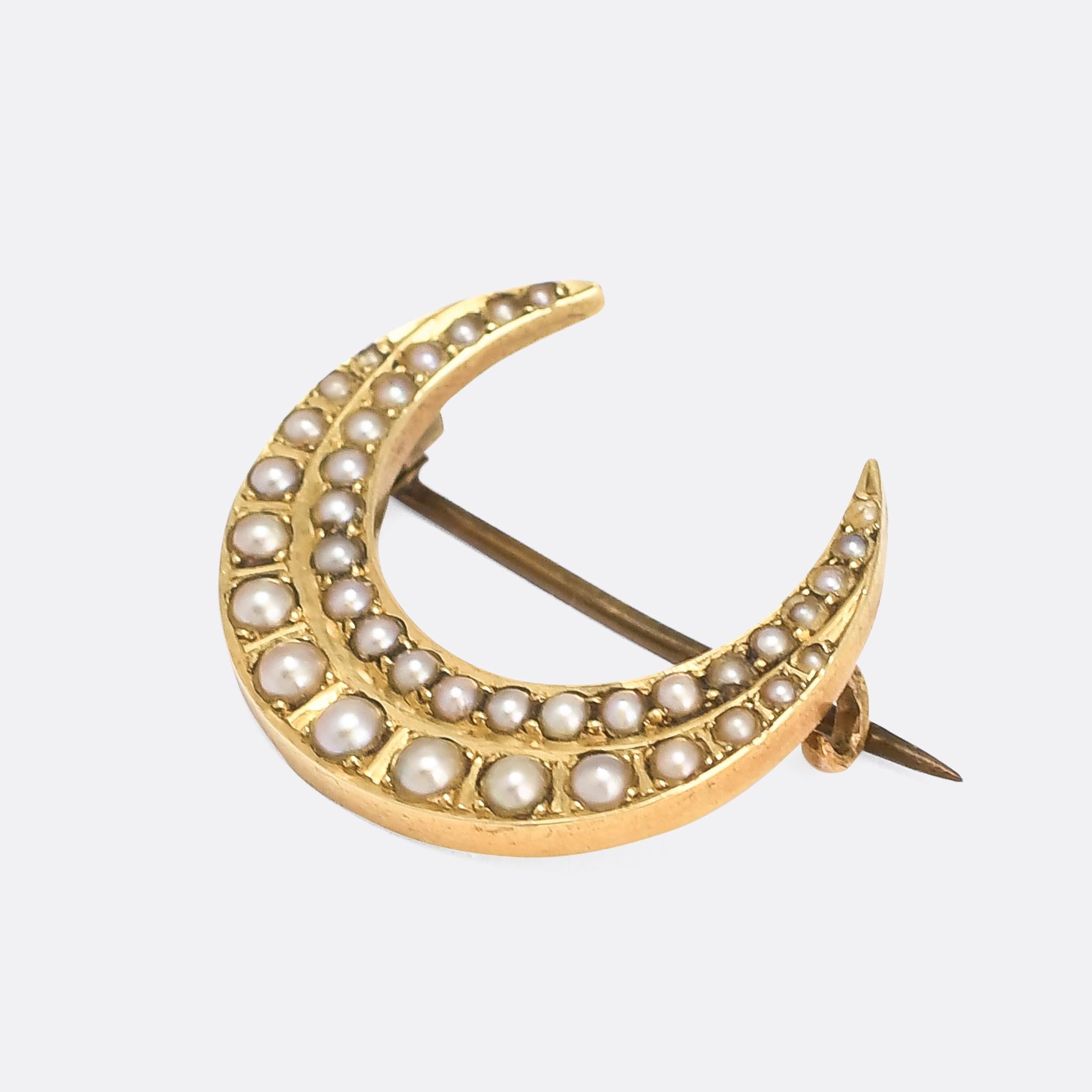 A gorgeous pearl set crescent moon brooch dating from the late Victorian period, circa 1880. It's crafted in 15 karat gold, and features two rows of natural pearls. If brooches aren't your thing, we can have a chain added for wear as a pendant - DM