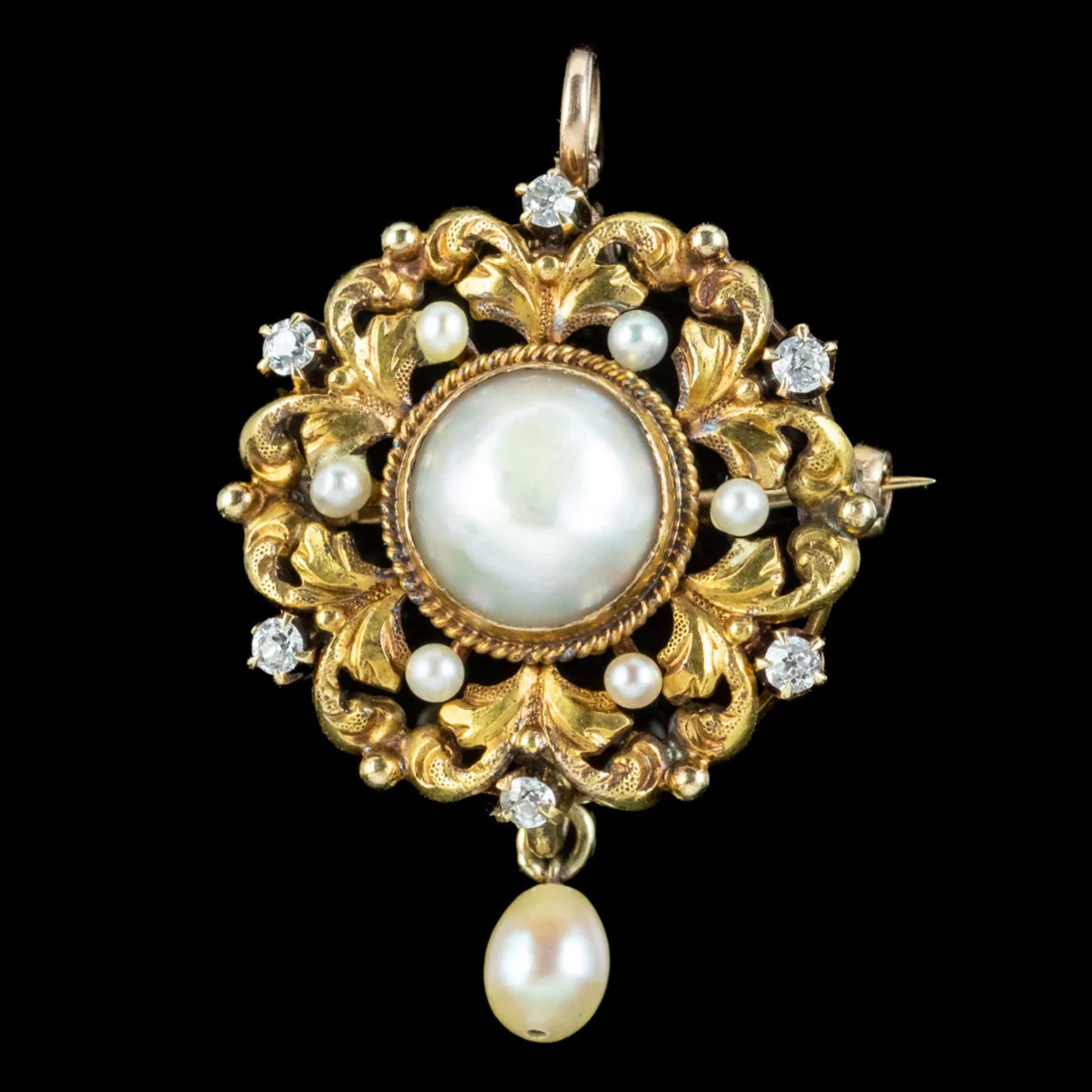 A beautiful little antique Victorian pendant/ brooch depicting a leafy, 18ct gold wreath, surrounding a large natural pearl in the centre. It has a lovely lustre and is complemented by a halo of twinkling old mine cut diamonds and smaller pearls,