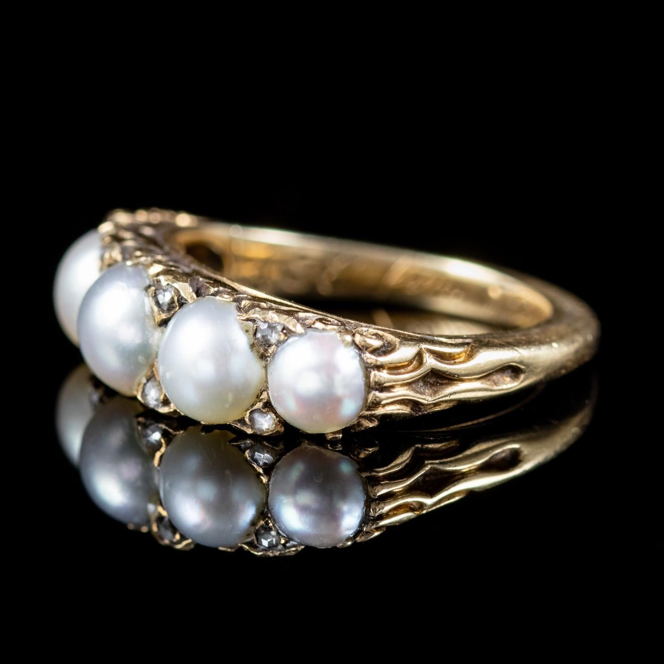 A beautiful antique ring from the Victorian era set with five natural Pearls with eight small Diamonds twinkling in-between. 

Pearls are a true gift from Mother Nature and symbolize purity innocence and beauty which is why they have been adored