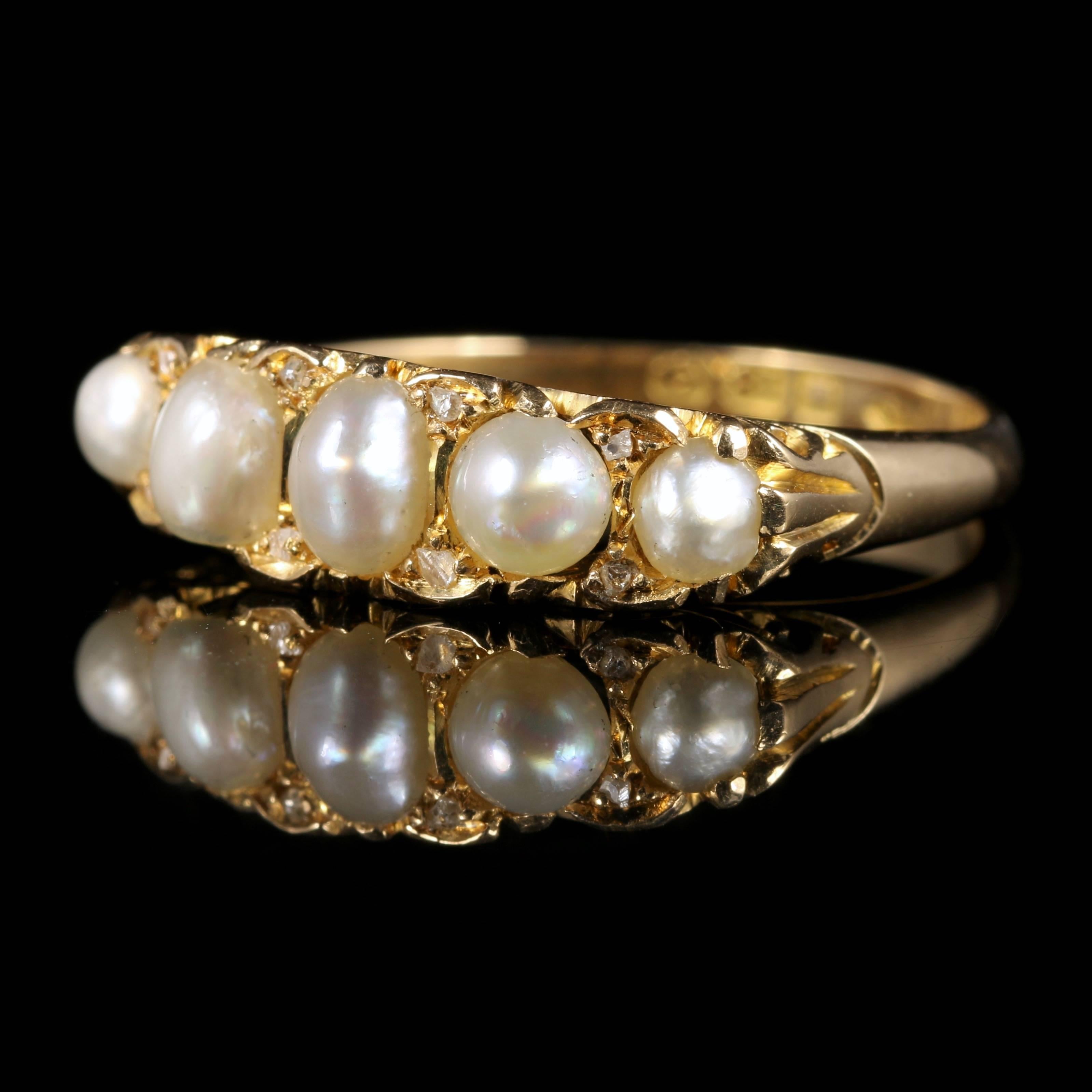 For more details please click continue reading down below...

This fabulous 18ct Yellow Gold ring is Victorian, Circa 1870.

Boasting 5 amazing Pearls with 8 rose cut Diamonds nestled in between, this really is a special ring.

The shank is