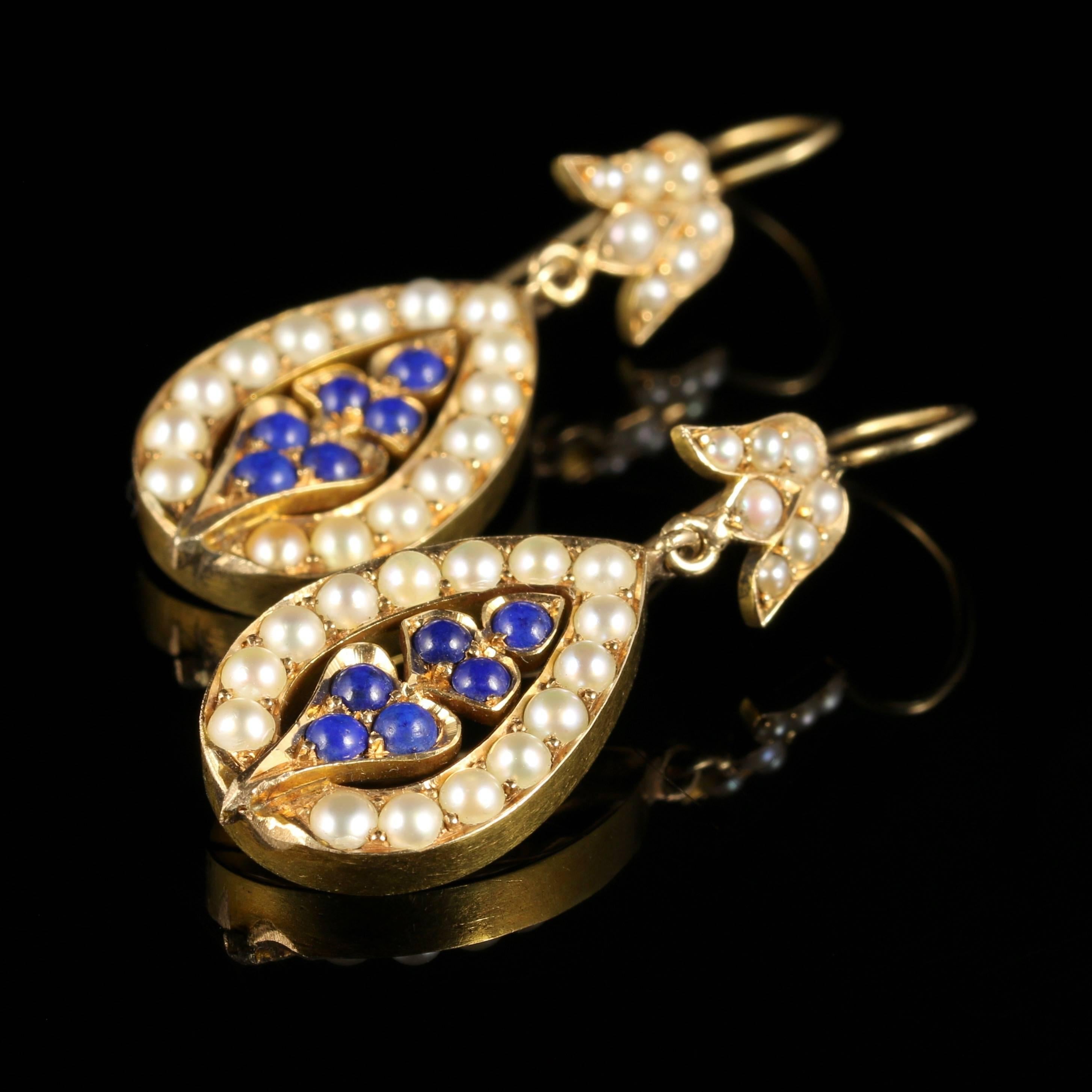 For more details please click continue reading down below...

These beautiful antique Victorian earrings are set with central cluster of Lapis Lazuli stones surrounded by lovely lustrous Pearls.

Circa 1880

Set into a 15ct Gold setting.

The