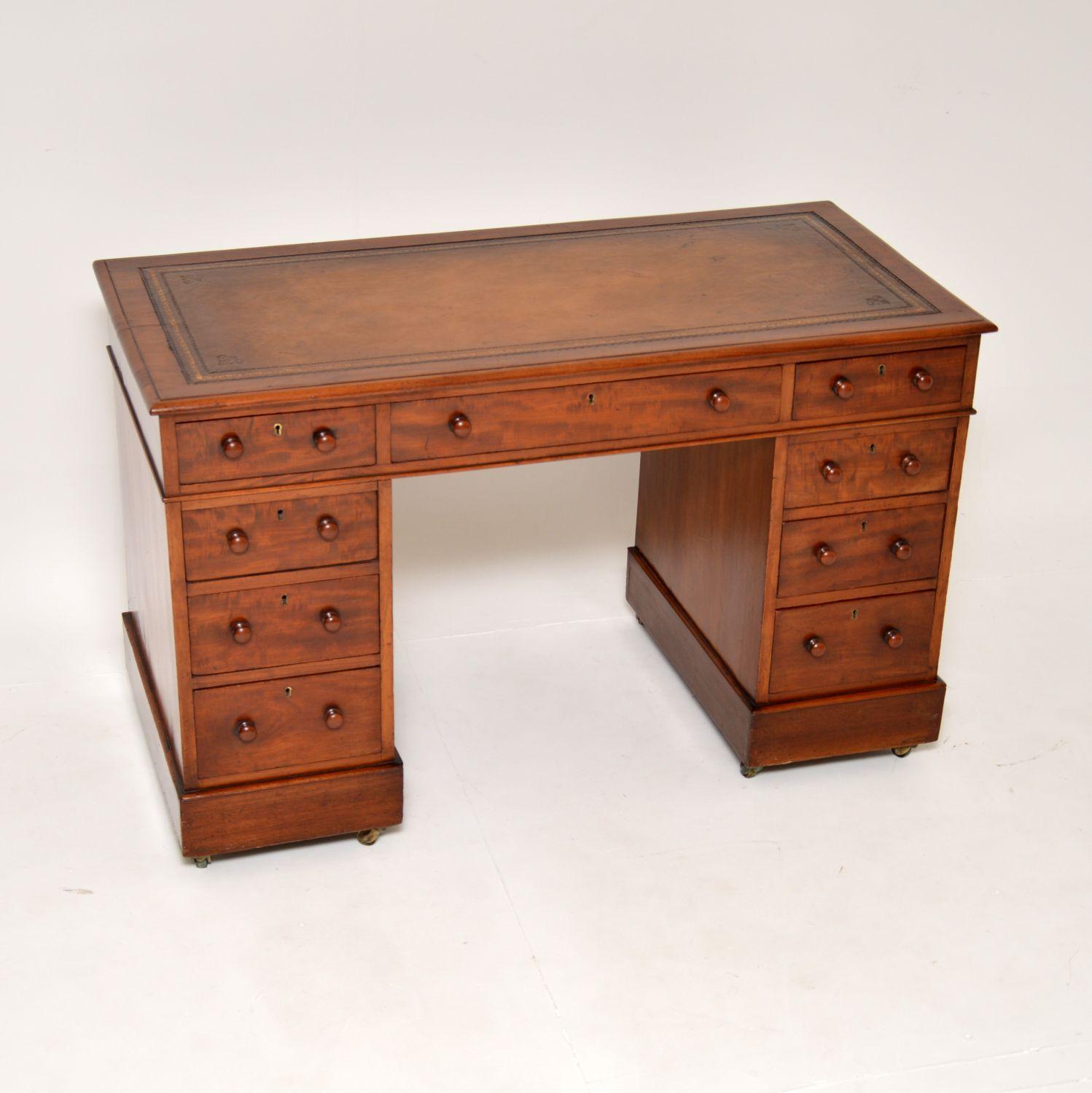 A charming antique Victorian period pedestal desk. This was made in England, it dates from around the 1860-80’s.

It is a useful size, quite compact for a pedestal desk, yet still offering ample work space and quite a wide knee hole space. The top