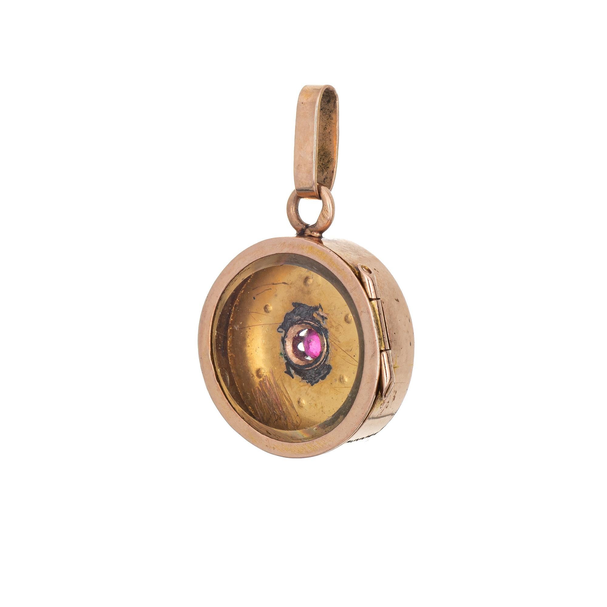 Finely detailed Victorian pendant or charm (circa 1880s to 1900s), crafted in 14 karat rose gold. 

Six seed pearls measure 1mm each, with an estimated 0.10 carat ruby set to the center.
The small pendant features a pearl and ruby set star to the
