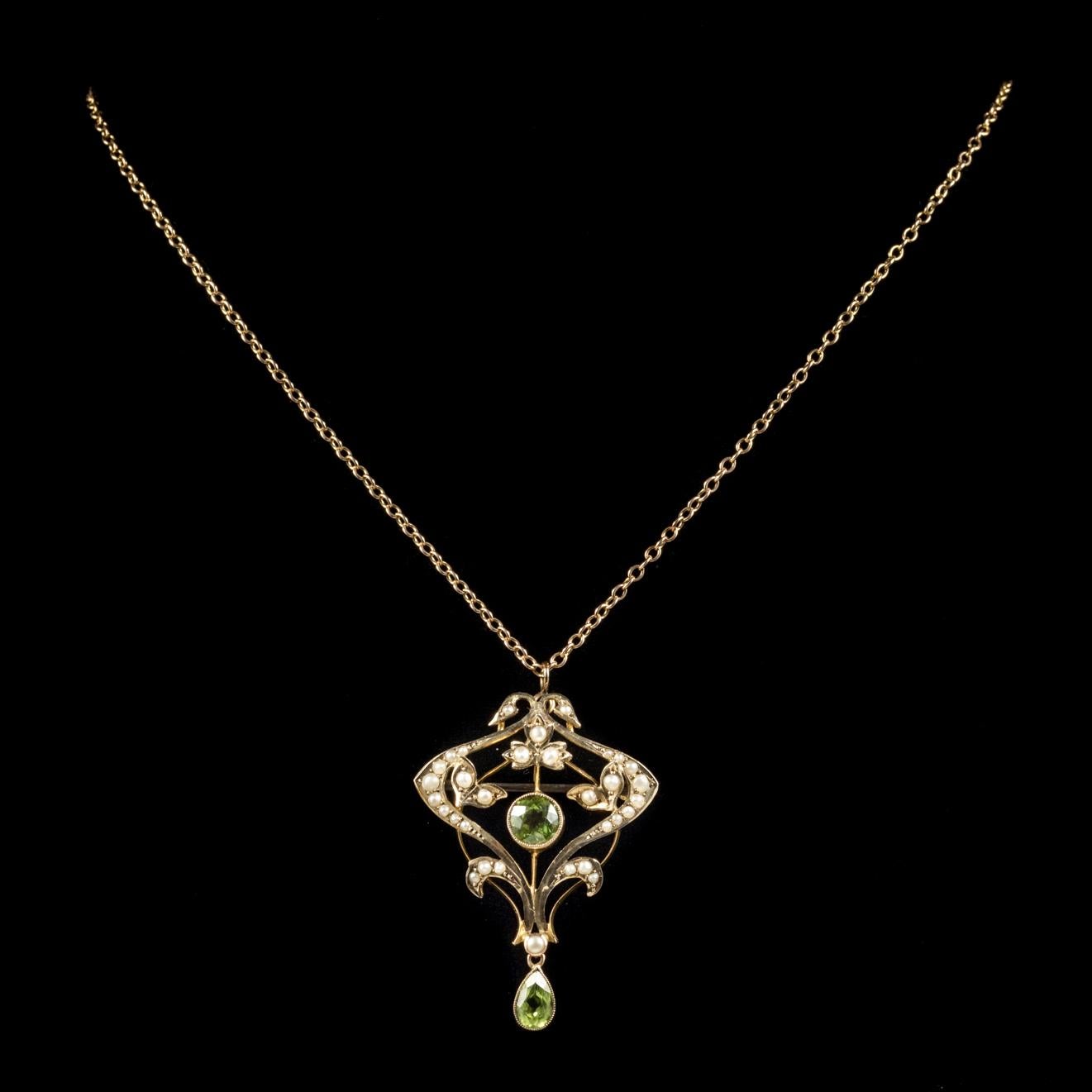This beautiful antique Gold pendant and chain is from the Victorian era, Circa 1900.

The fabulous pendant is decorated in lustrous Pearls and boasts a rich green Peridot dropper and a 0.65ct Peridot in the centre. 

Peridot is a stone of lightness