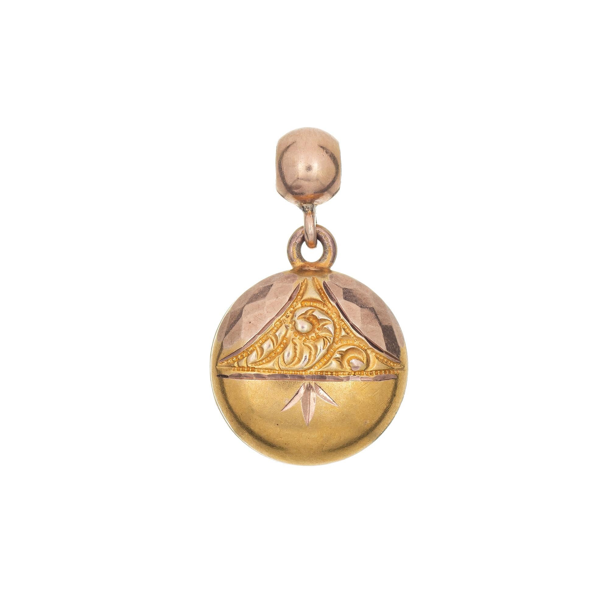 Finely detailed Victorian pendant or charm (circa 1880s to 1900s), crafted in 10 karat yellow gold. 

The small pendant features hand etched & chased detail to both sides. Small in scale (1/2 inch) the pendant is great worn as a pendant on a chain