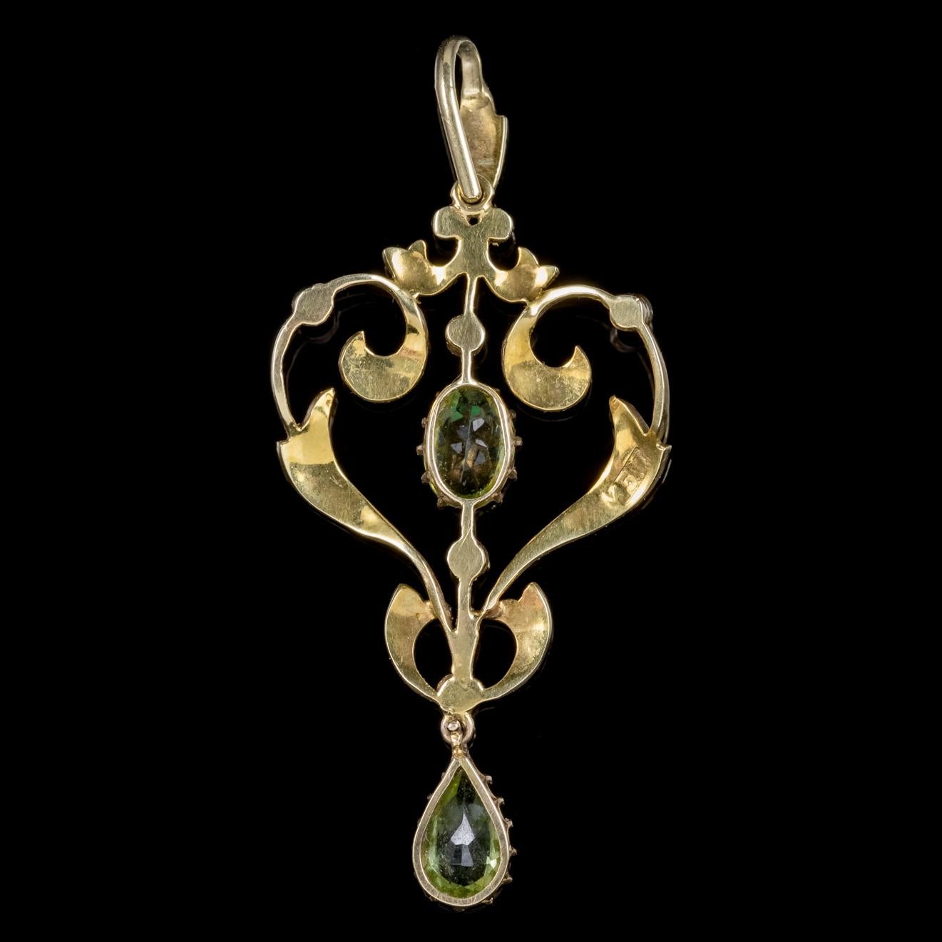 A beautiful antique Victorian pendant C. 1900, adorned with rich green Peridots and lovely natural Pearls. 

Peridot is a stone of lightness and beauty and was believed to be a stone of springtime by ancients who considered it a gift from Mother