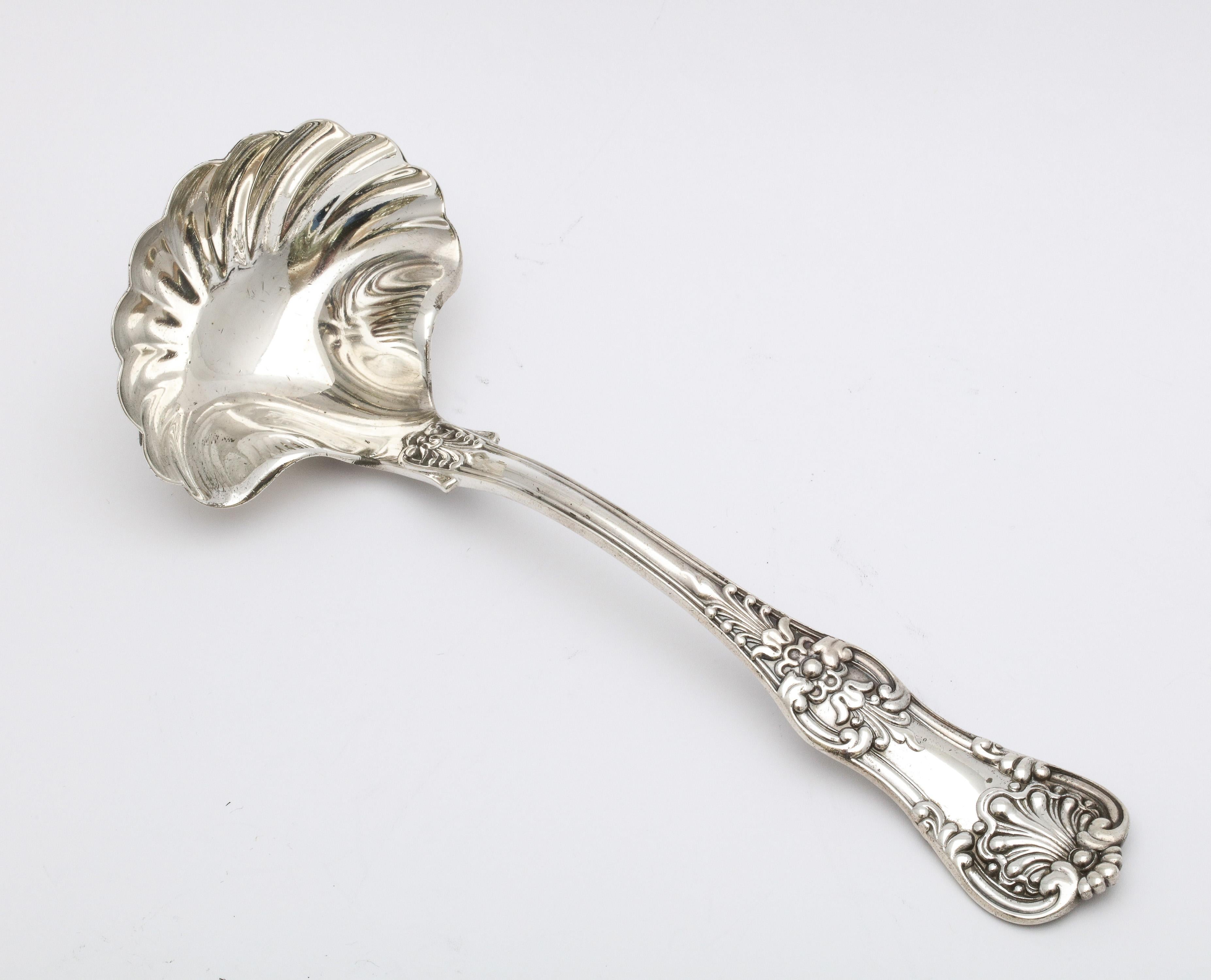 Antique, Victorian Period, sterling silver sauce ladle, Tiffany and Co., New York, Ca. 1885. Lovely design. Measures almost 7 1/2 inches long x 2 3/4 inches deep across the bowl of the ladle (widest point) x 2 inches high when lying flat.  Weighs