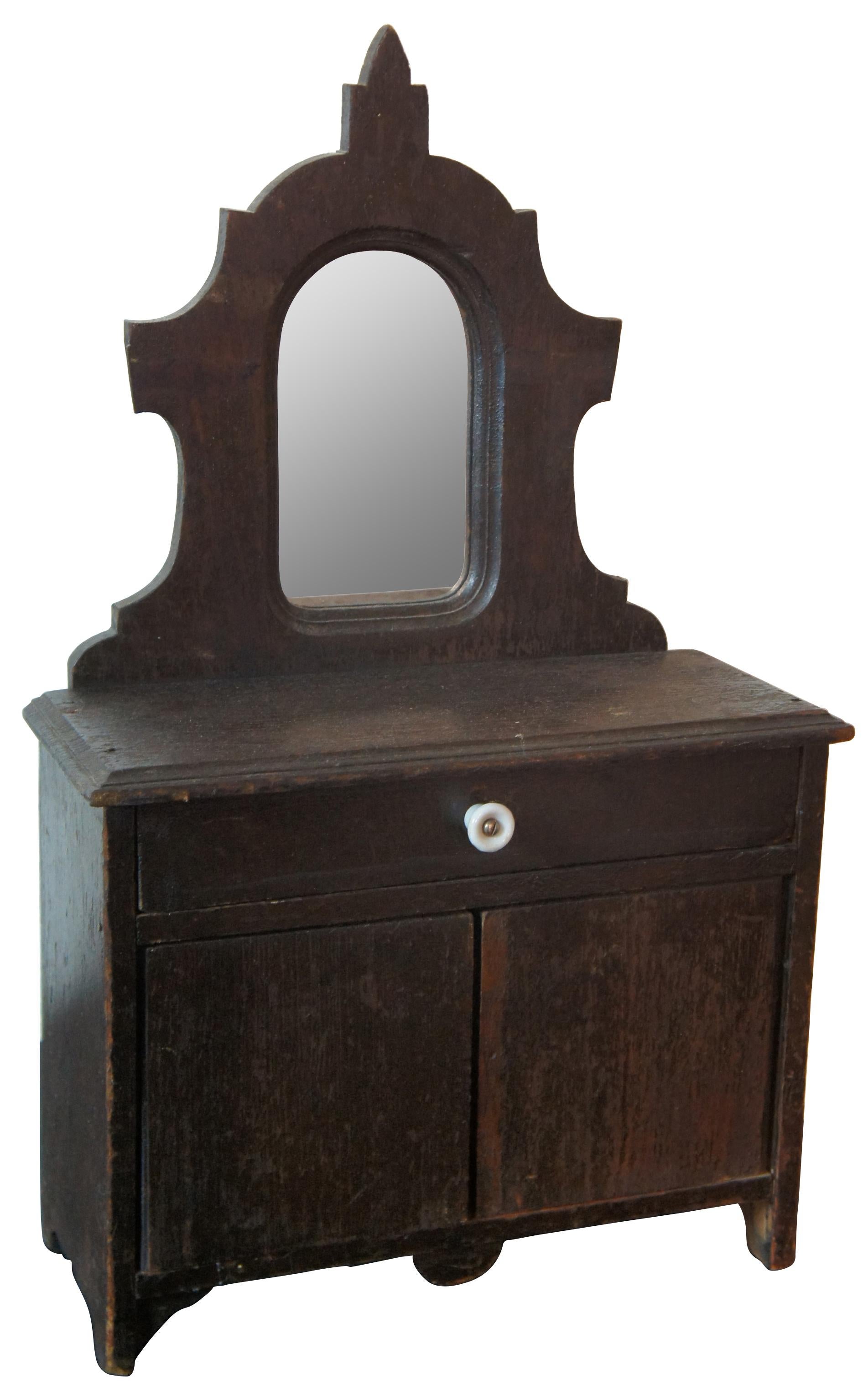 black antique dresser with mirror
