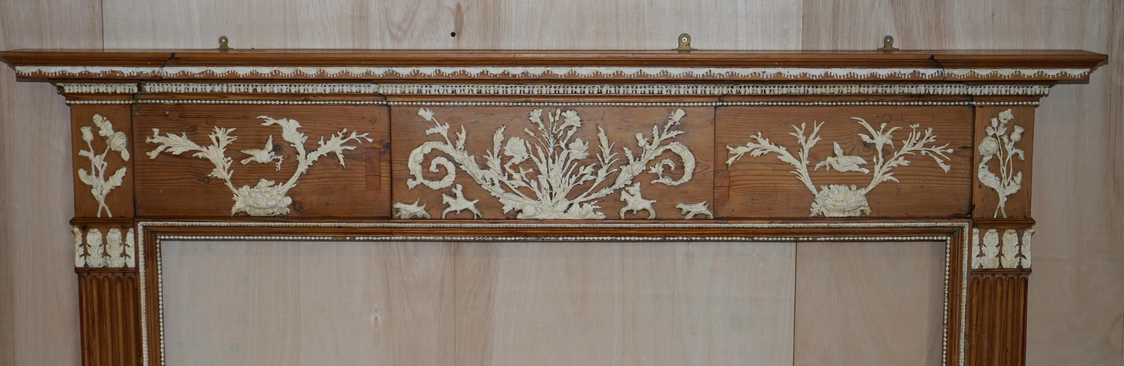 We are delighted to offer this lovely Victorian pitch pine & Gesso circa 1860 fire surround

A very good looking and highly decorative fire surround, the gesso plaster detailing is exquisite, there seems to be a chap riding a horse, some pigs or