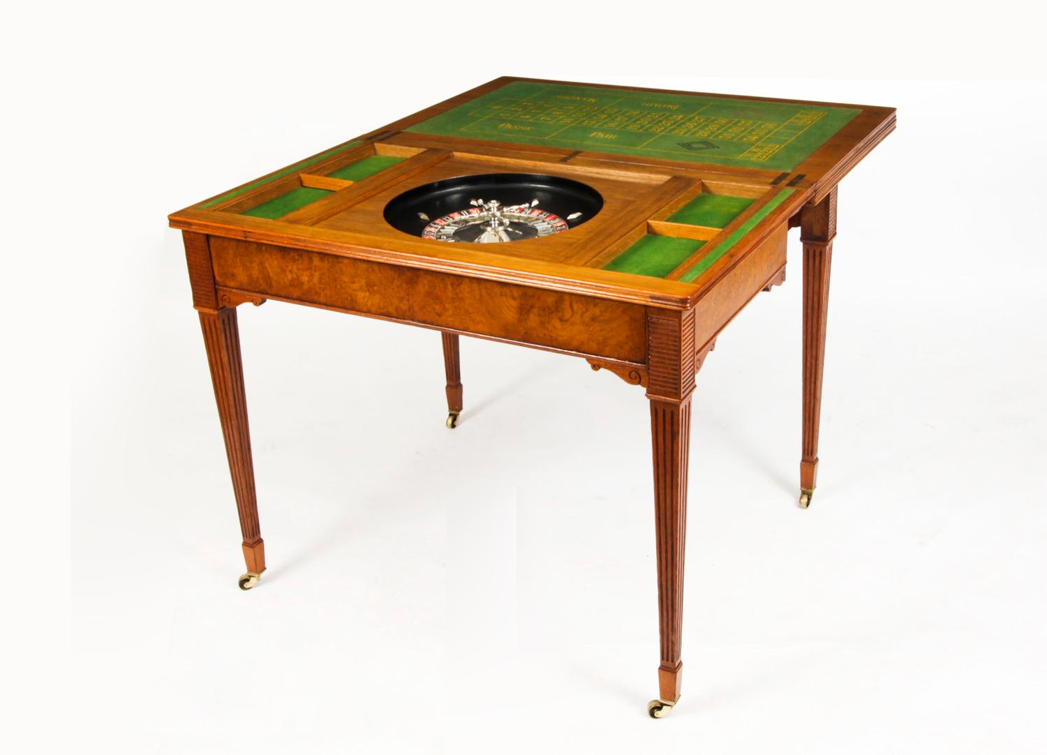 This is a fabulous high quality antique English Victorian pollard oak and boxwood inlaid metamorphic triple top games table for cards and roulette, circa 1870 in date.
 
The hinged triple top opens to reveal the green baize lined gaming interior