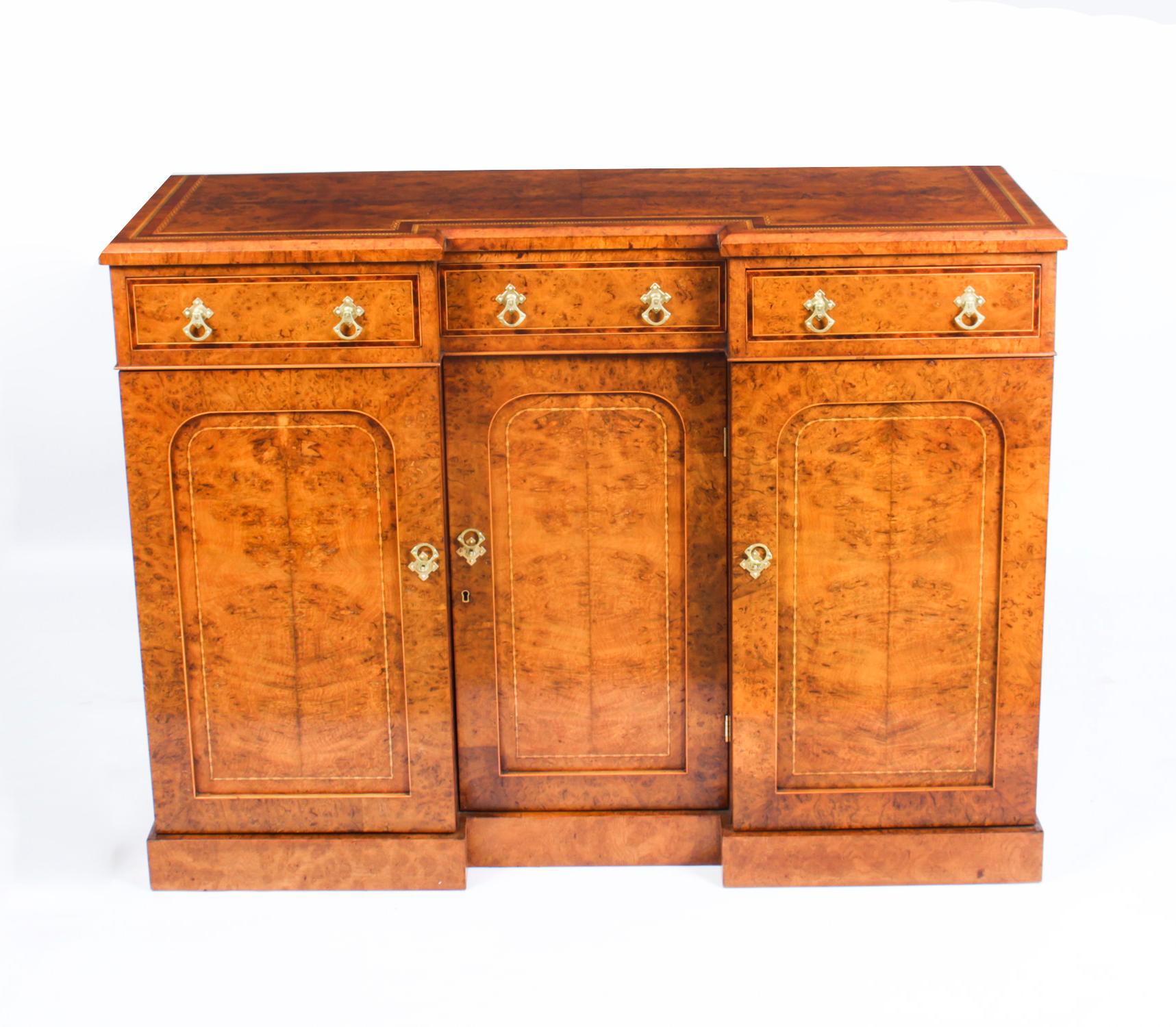 A superb quality Victorian flame pollard oak inverted breakfront sideboard, circa 1870 in date.

The sideboard features three drawers in the frieze and a breakfront design with three paneled doors below opening to cupboards with shelves

Add an