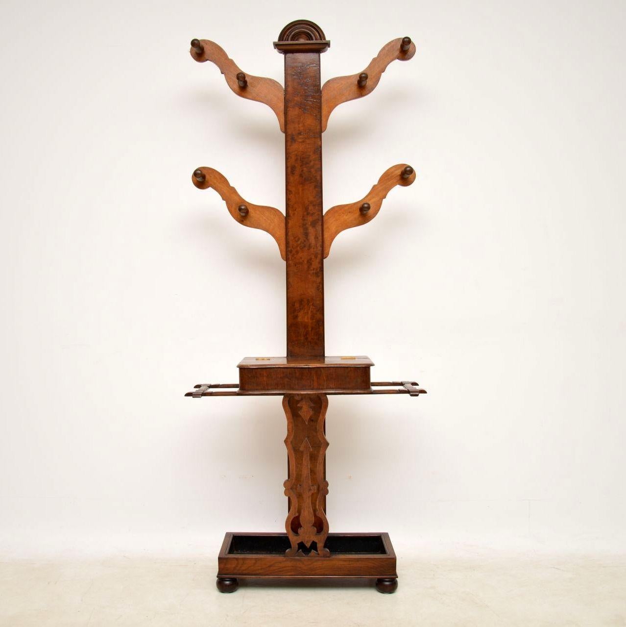 Very unusual antique Victorian tree hall stand with a great design and use of woods. It’s mainly oak, however the long middle section is Pollard oak, which has a similar look to burr walnut and was favoured a lot in the Victorian period. It has an