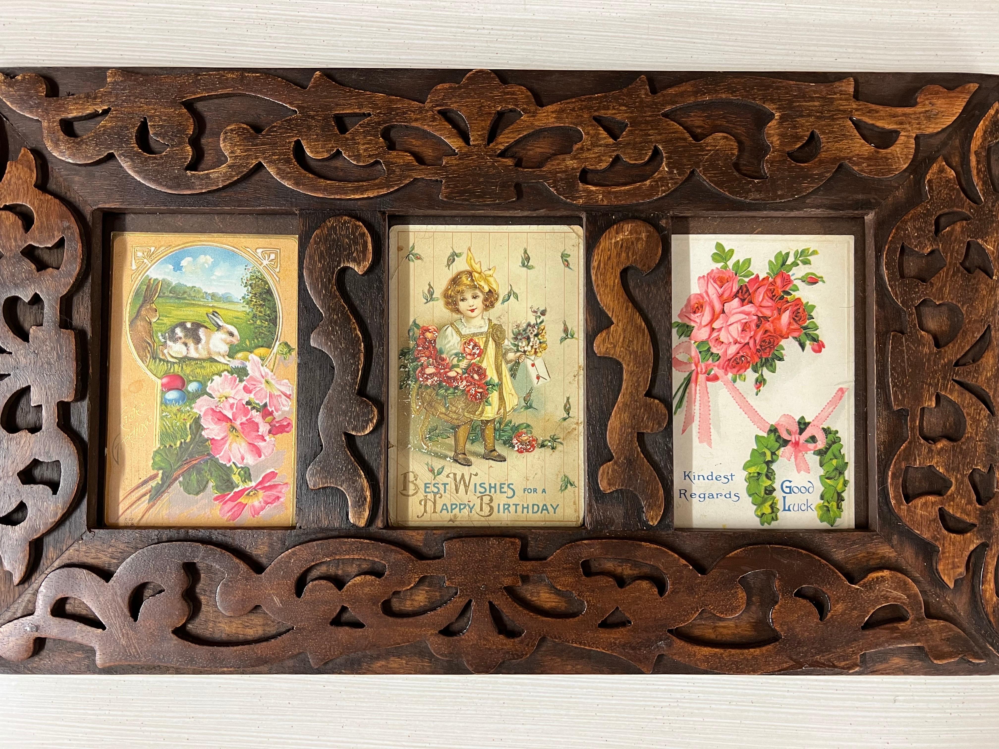 Antique Victorian Postcards in a carved wooden frame. The first card is an Easter postcard with a bunny rabbit. The second one is a Birthday postcard for a child. The third one is a Good Luck postcard with a wreath and flowers. They are all