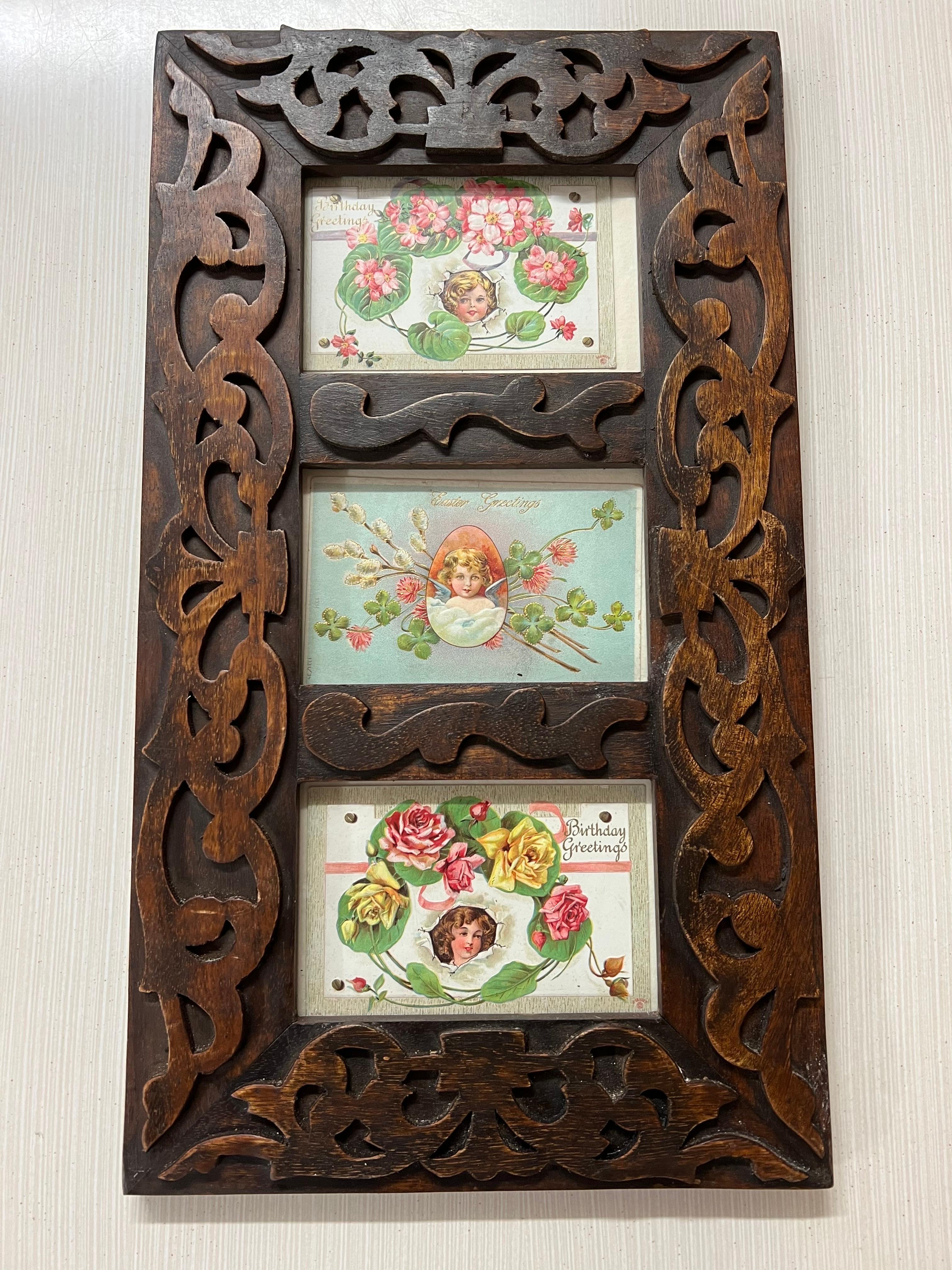 Three antique Victorian Postcards in carved wooden frame. The top and bottom postcards are Birthday Greetings and the middle one is an Easter Greeting. These are real vintage postcards. Not reproductions. The frame is a reproduction but still solid