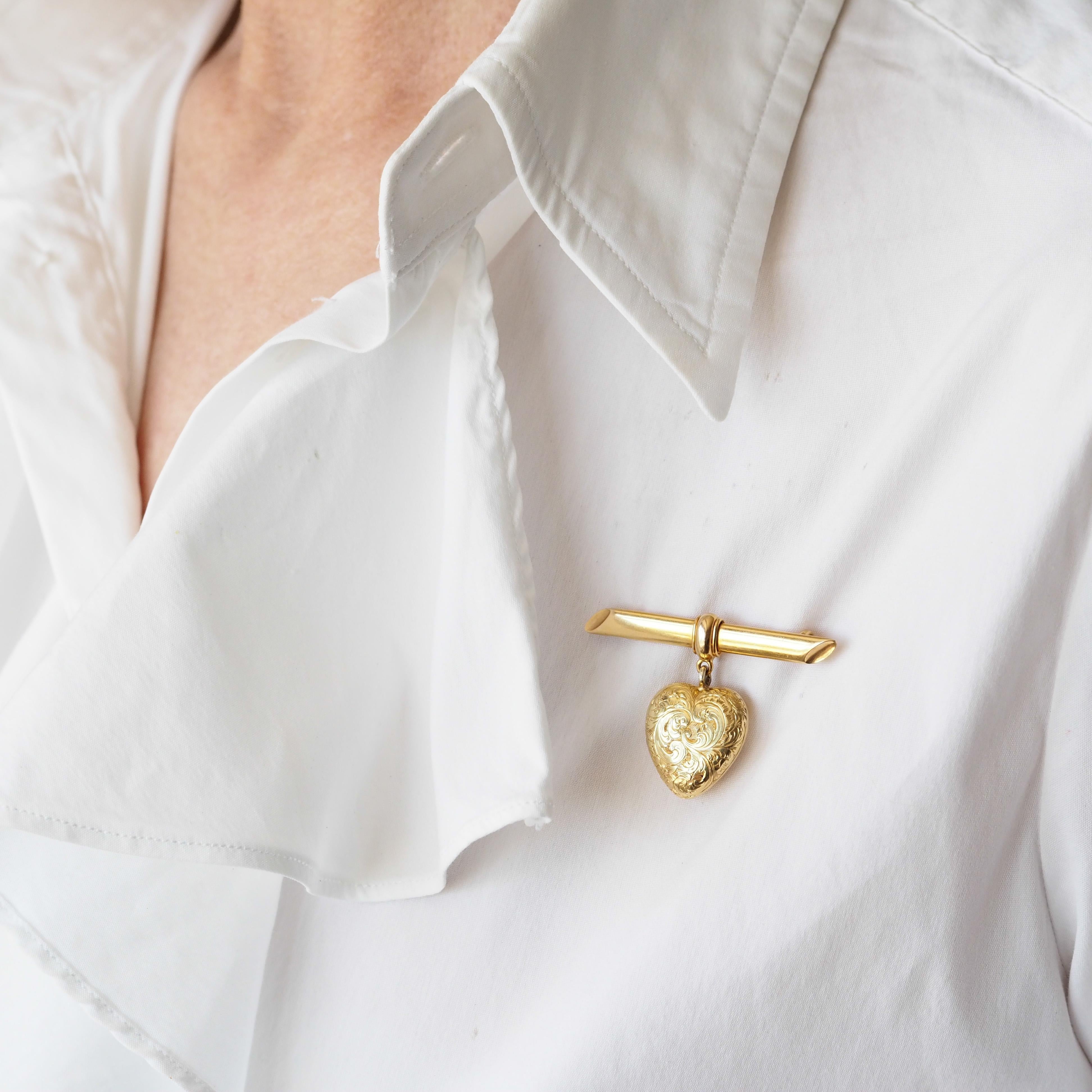 We are delighted to offer this stunning antique Victorian 'puffy' heart locket brooch made c.1890.

The brooch is made from solid 18ct gold and has a wonderful 'buttery' yellow gold tone that exudes Victorian elegance and opulence.

From the top bar
