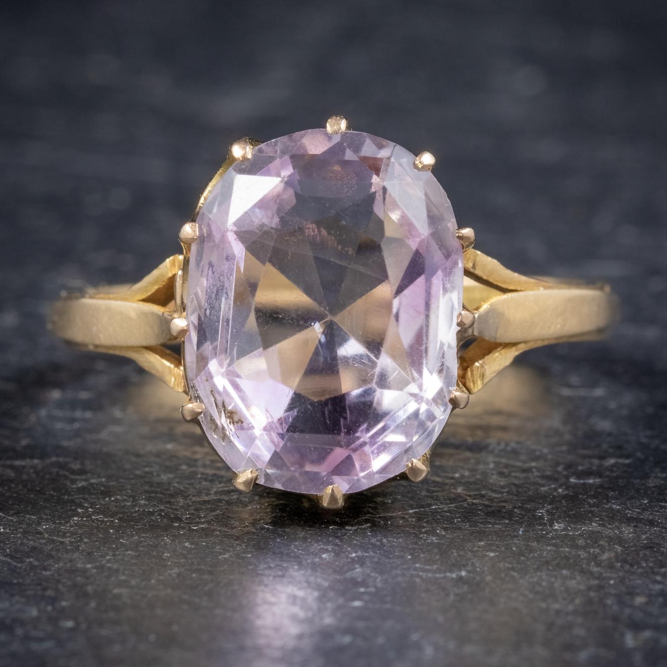 A wonderful antique Victorian statement ring C. 1900, set with a gorgeous pale purple Spinel which is approx. 5ct in size. 

The stone is claw set in a beautiful Yellow Gold crown shaped mount which is stamped 18ct on the inside of the shank along