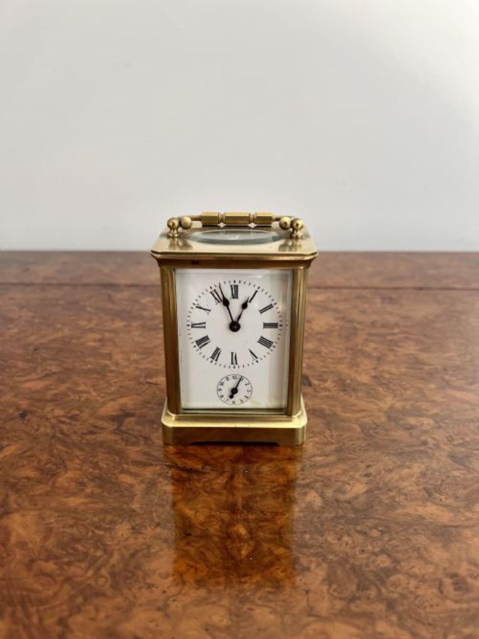 Antique Victorian quality brass carriage clock with an alarm having a quality antique Victorian brass carriage clock with an alarm clock with a French eight day movement with an alarm striking on a bell, a white dial with Roman numerals, the