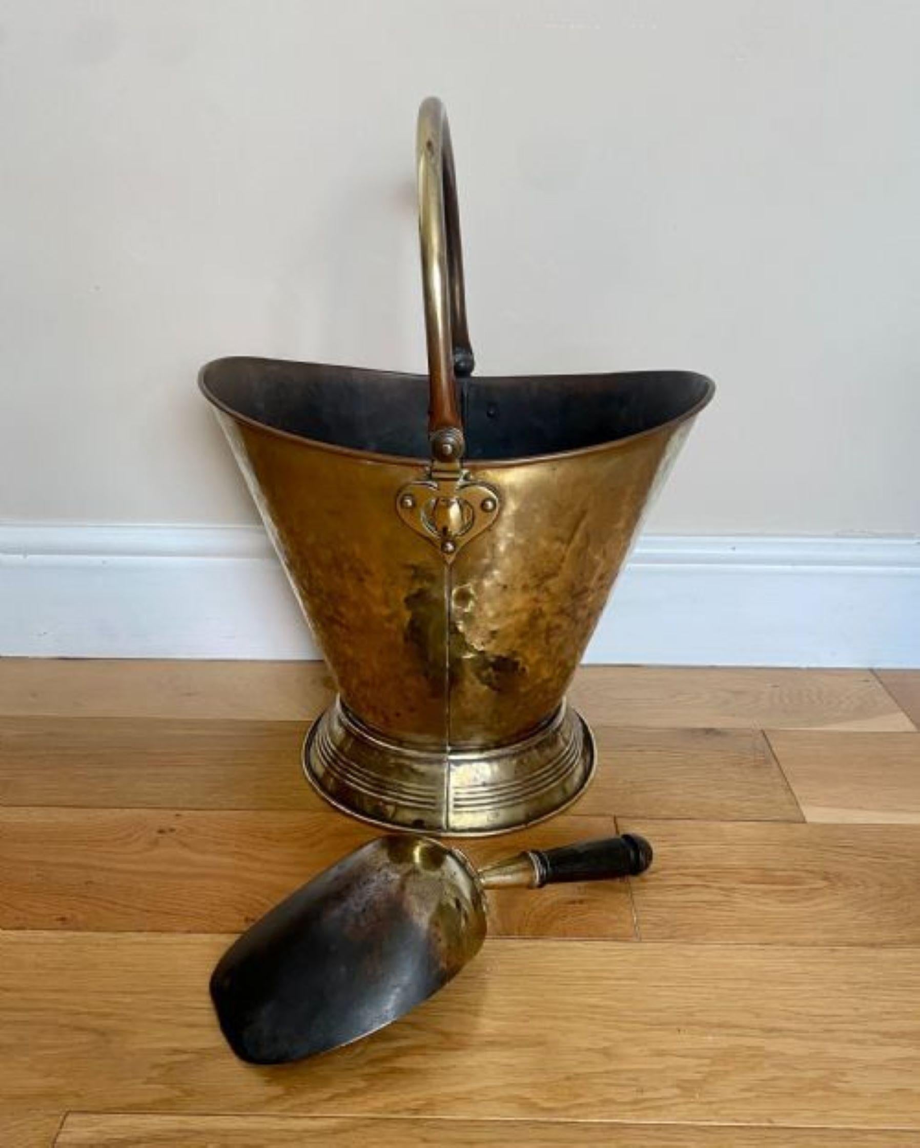 Antique Victorian quality brass coal scuttle with original brass shovel having a quality brass coal scuttle with a swing handle and the original brass shovel