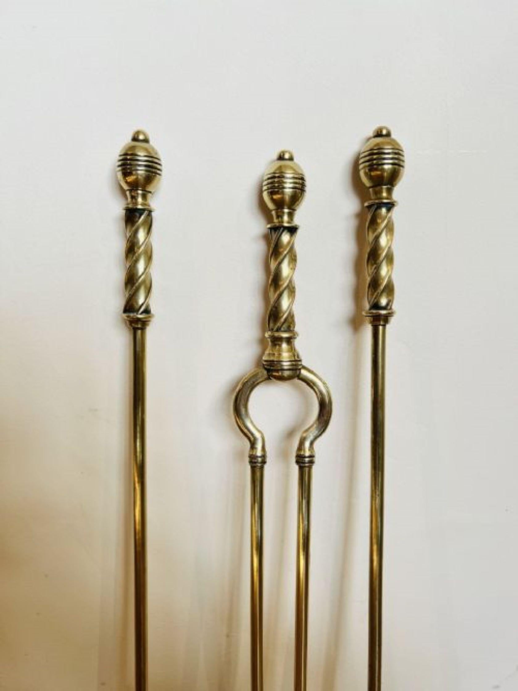 Antique Victorian quality brass fire irons having a quality set of fire irons with rope twist handles consisting of a shovel, poker and a pair of tongs.
