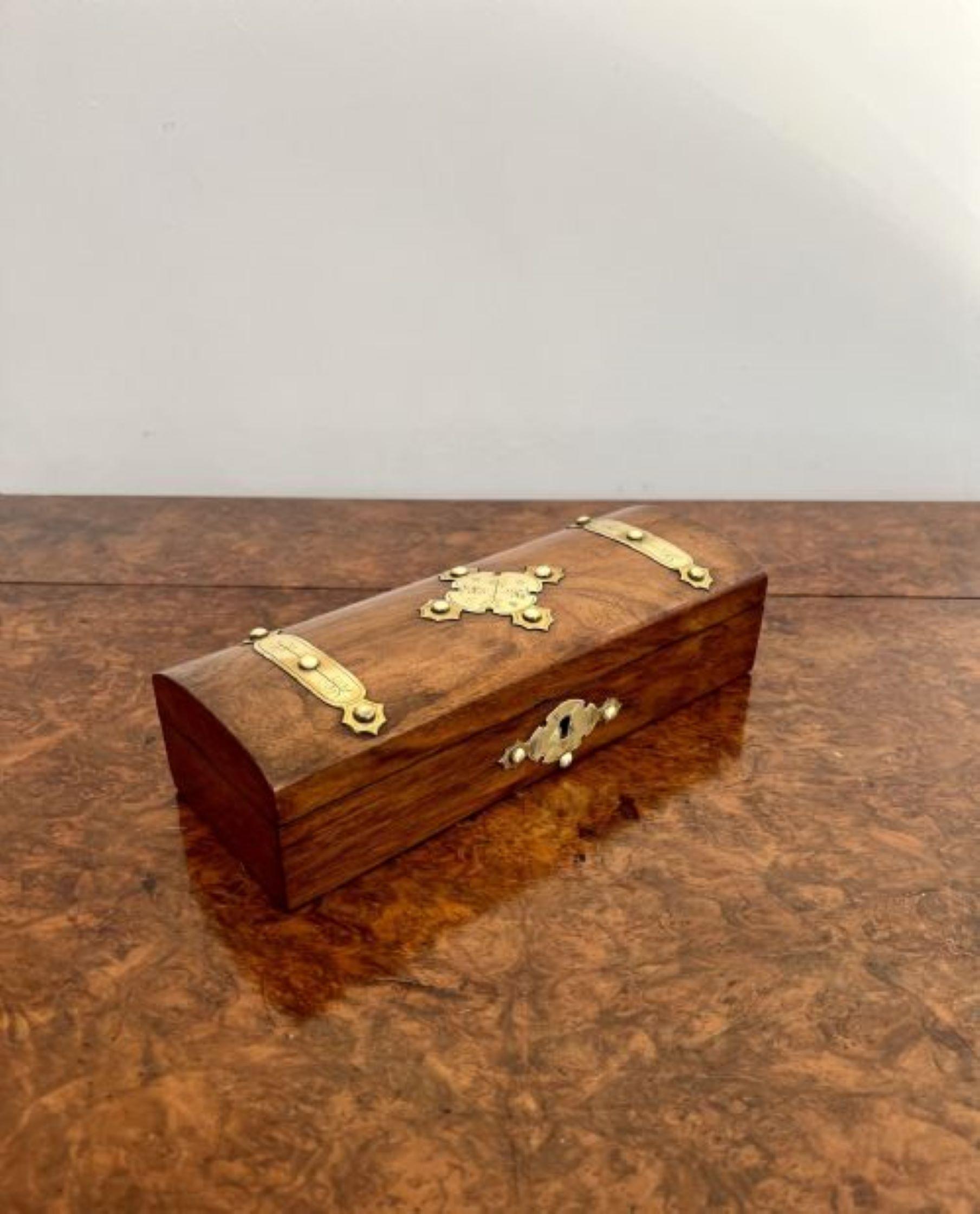 Antique Victorian quality burr walnut and brass mounted glove box having a quality burr walnut glove box with original engraved mounts a dome shaped lid opening to reveal a storage compartment.