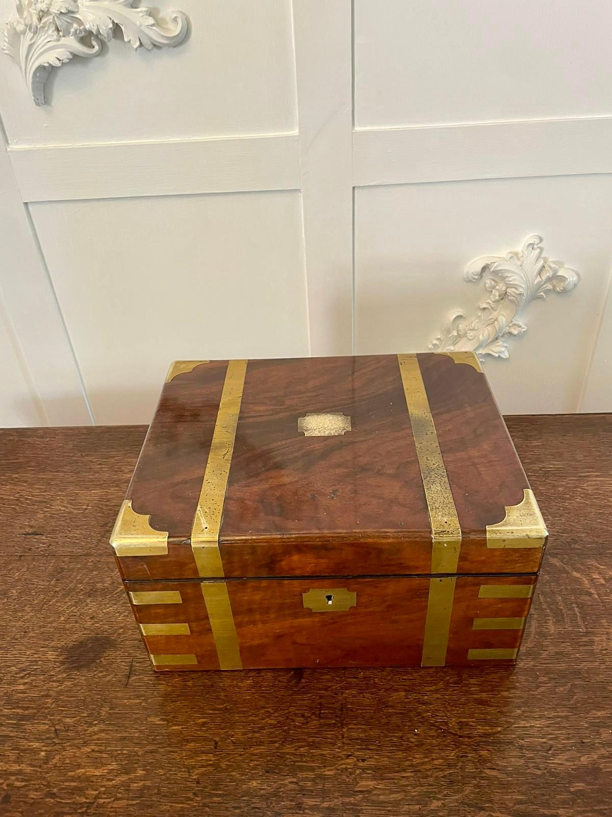 Antique Victorian quality burr walnut writing box with brass bound corners and straps opening to reveal a fitted writing slope, pen tray, original ink bottle, two lift up lids opening to reveal a storage compartment and two secret drawers