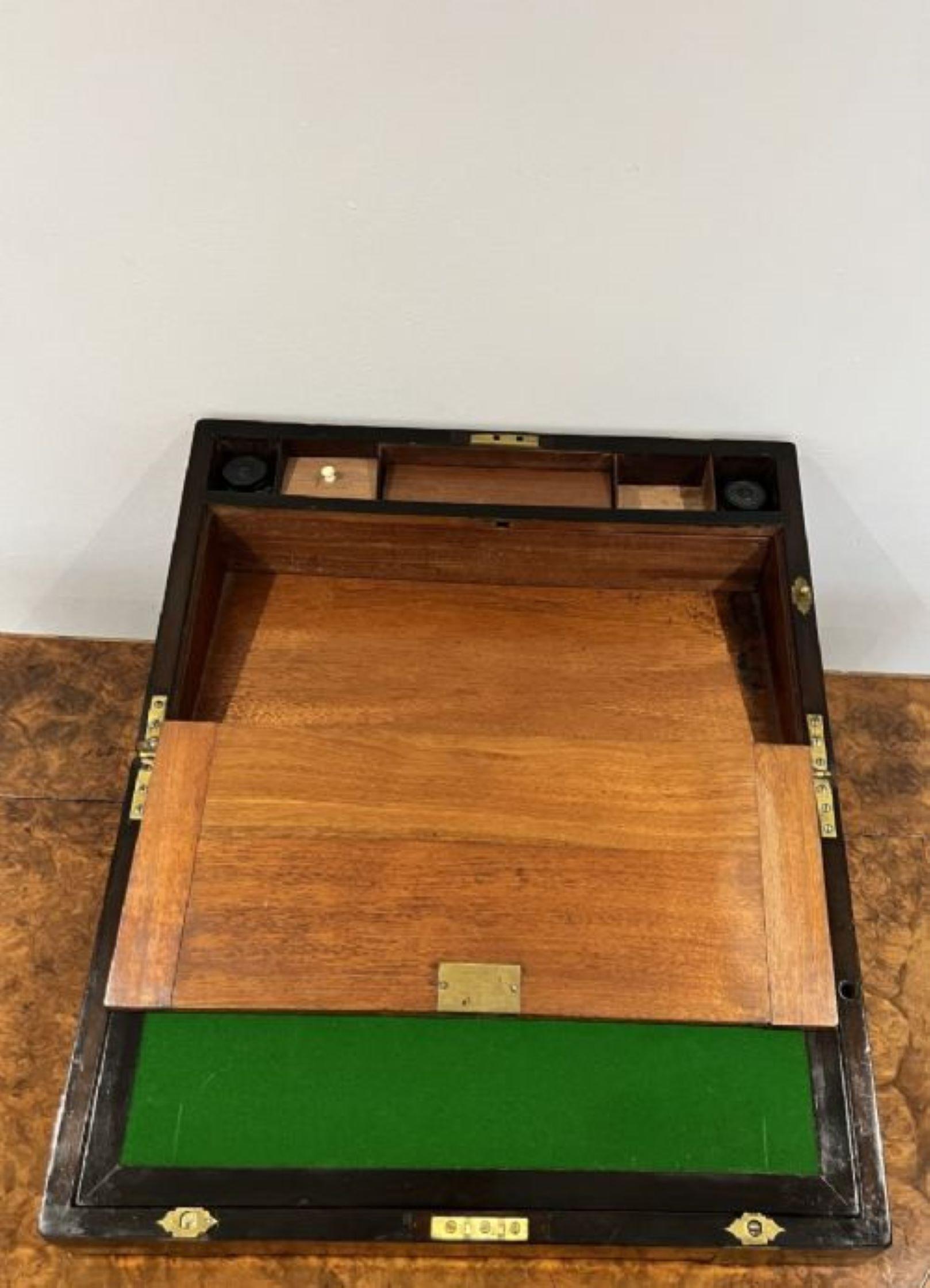 Antique Victorian quality burr walnut brass bounded writing box having a quality antique Victorian burr walnut brass bounded writing box opening to reveal a writing surface with green baize having a pen tray, two compartments to the base and one