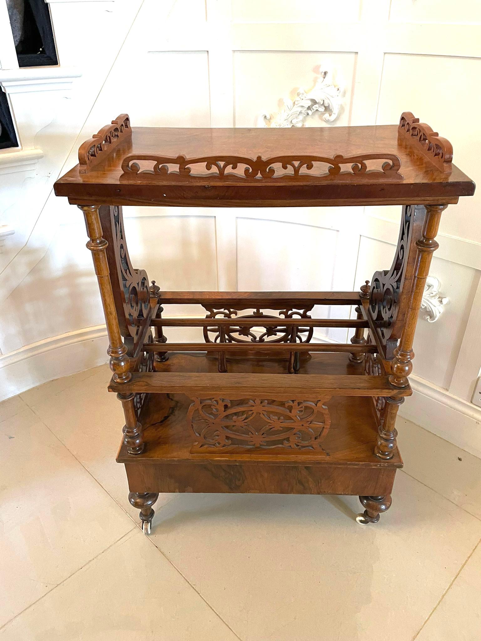 Antique Victorian quality burr walnut Canterbury with galleried superstructure supported by beautiful fret-carved scrolling supports issuing from a Canterbury base with fret-carved side panels and dividers, the base fitted with a drawer and original