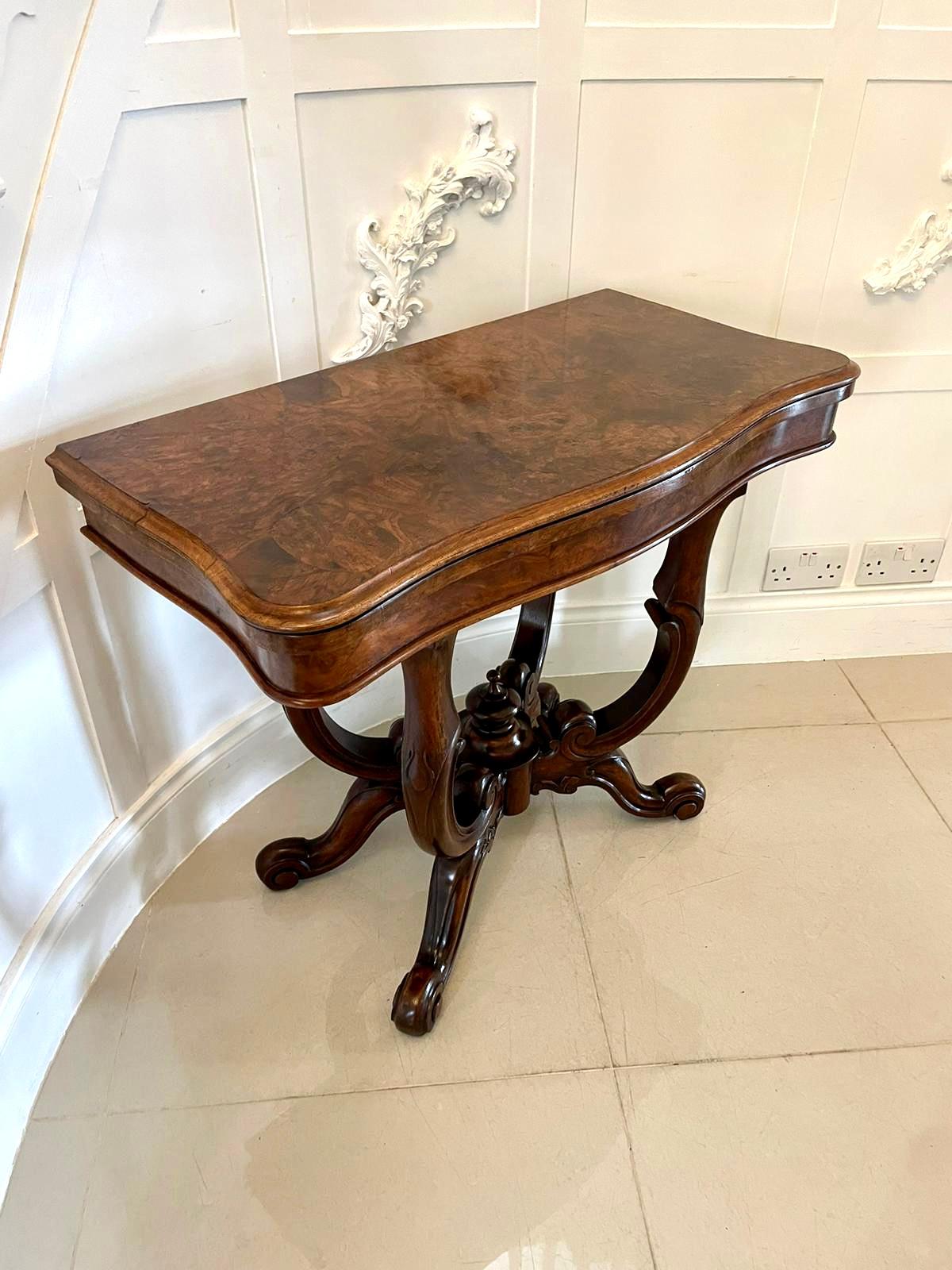 Antique Victorian quality burr walnut card/side table having a quality burr walnut serpentine shaped swizzle top with a thumb moulded edge opening to reveal a baize interior, serpentine shape frieze supported by a shaped carved solid walnut basket