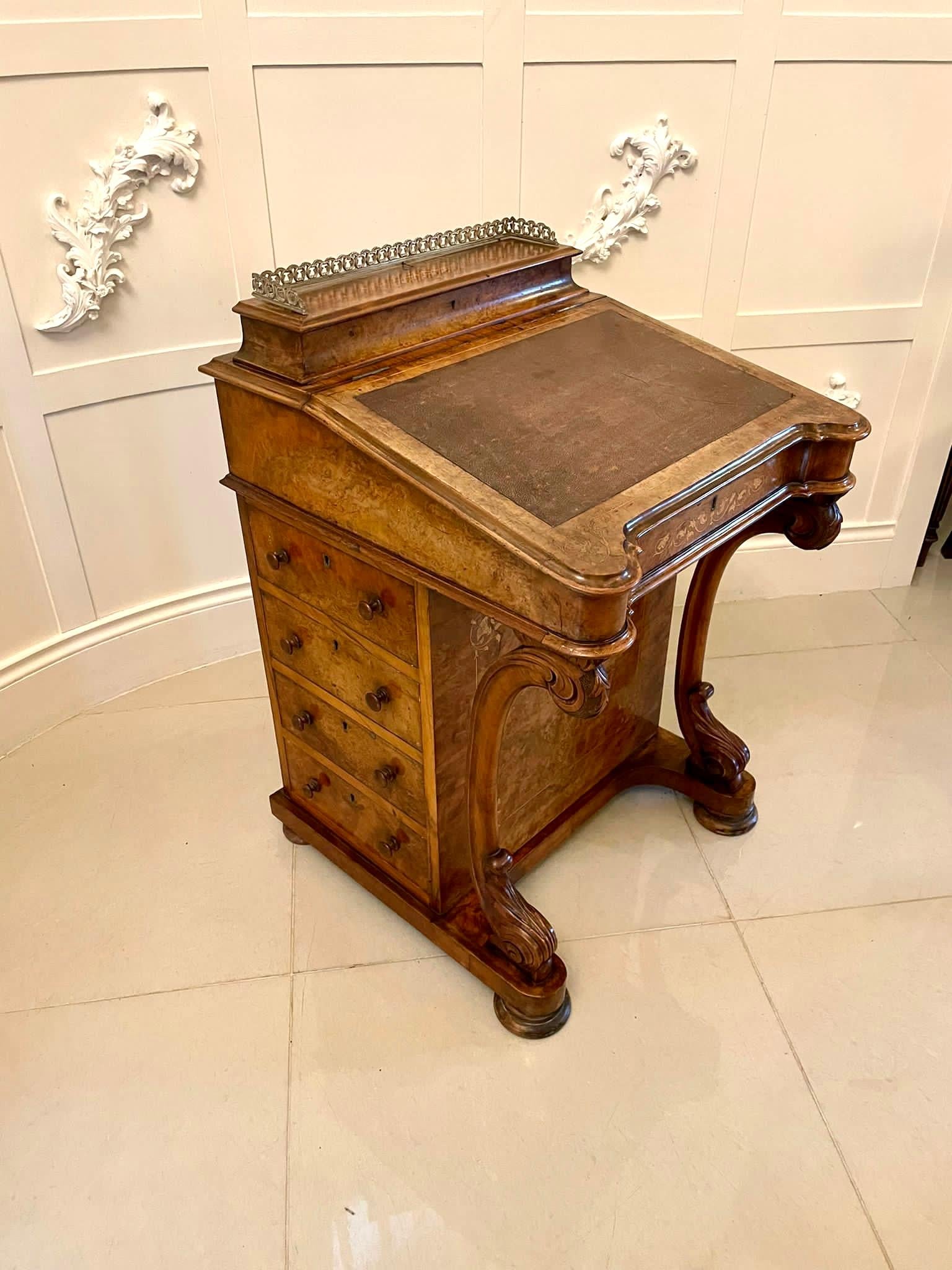Antique Victorian quality burr walnut inlaid freestanding davenport having the original brass gallery over lift up lid opening to reveal a storage compartment, sloped writing surface with a leather inset crossbanded in burr walnut, four working