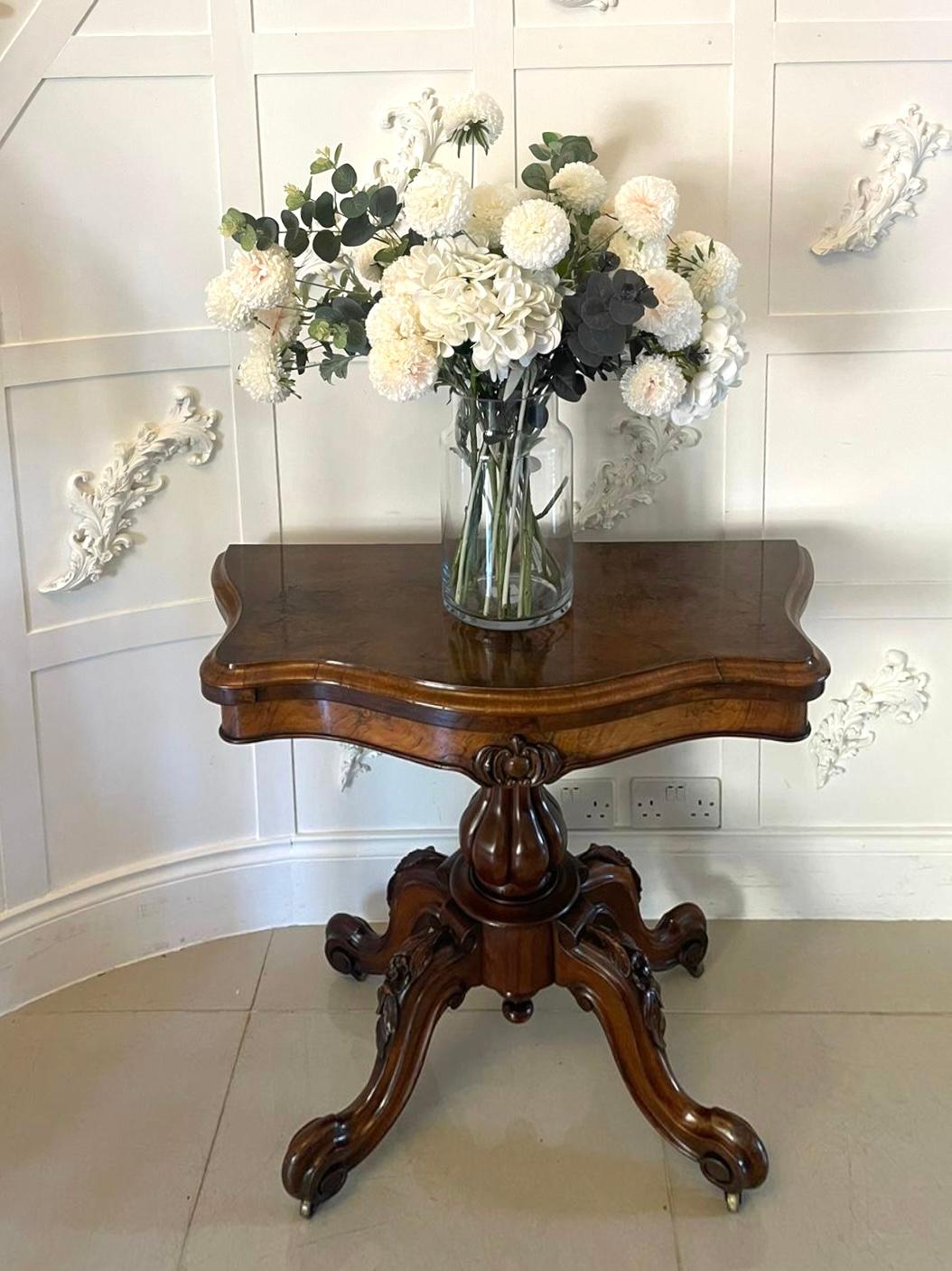 Antique Victorian quality burr walnut serpentine shaped card/console table having a quality burr walnut serpentine shaped swivel top with a moulded edge opening to reveal the original green baize interior, burr walnut carved frieze supported by a